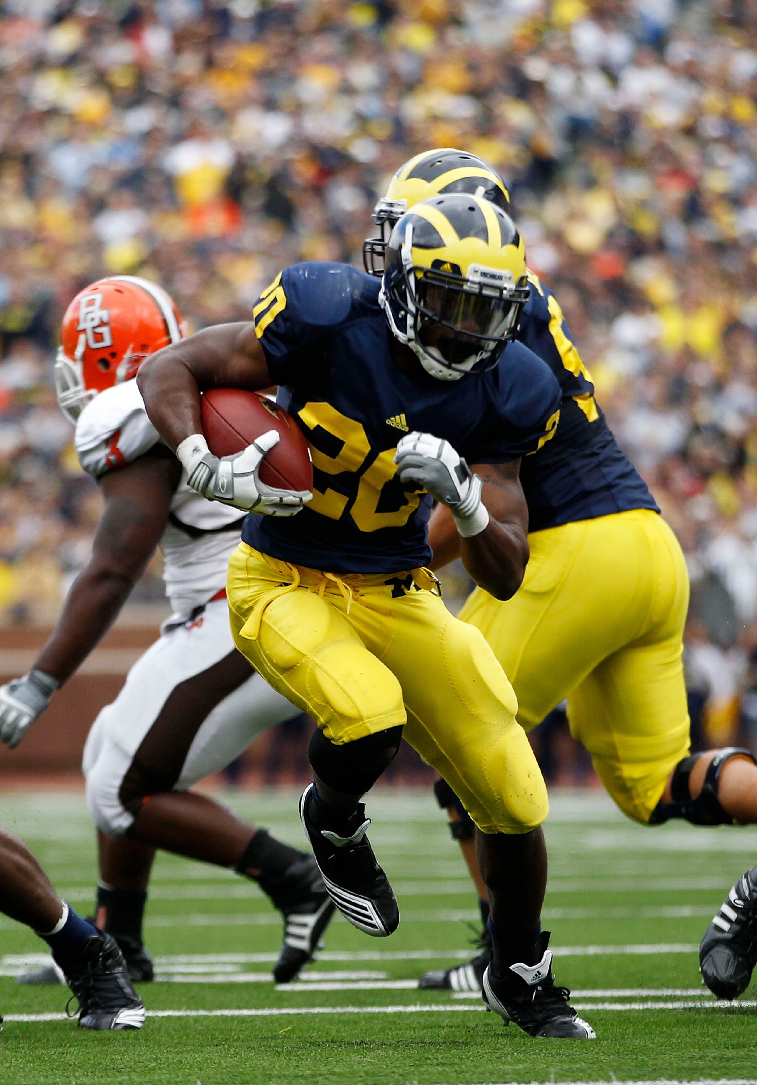 ANN ARBOR, MI - SEPTEMBER 25: Michael Shaw #20 of the Michigan Wolverines runs for a second quarter touchdown during the game against Bowling Green on September 25, 2010 at Michigan Stadium in Ann Arbor, Michigan.  (Photo by Leon Halip/Getty Images)