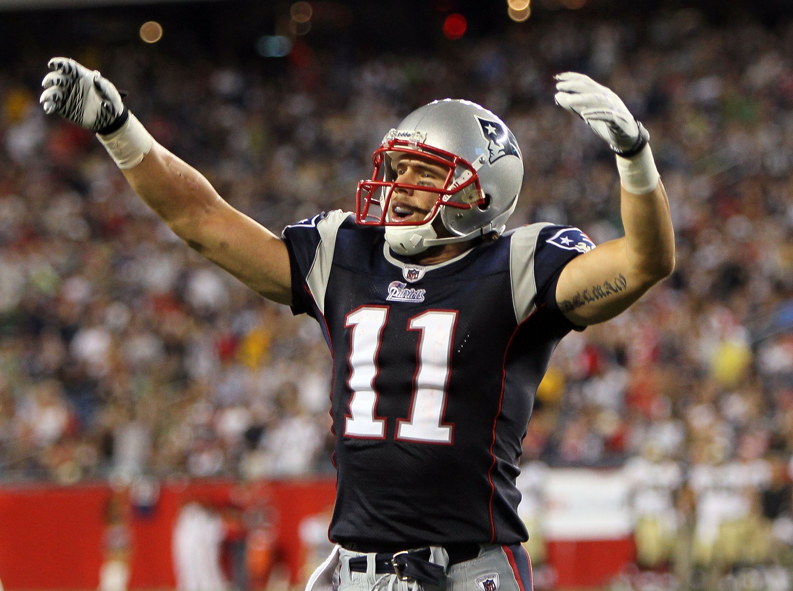 FOXBORO, MA - AUGUST 12: Julian Edelman # 11 of the New England Patriots reacts after a second-quarter touchdown during the preseason game against the New Orleans Saints at Gillette Stadium on August 12, 2010 in Foxboro, Massachusetts. (Photo by Jim Rogas