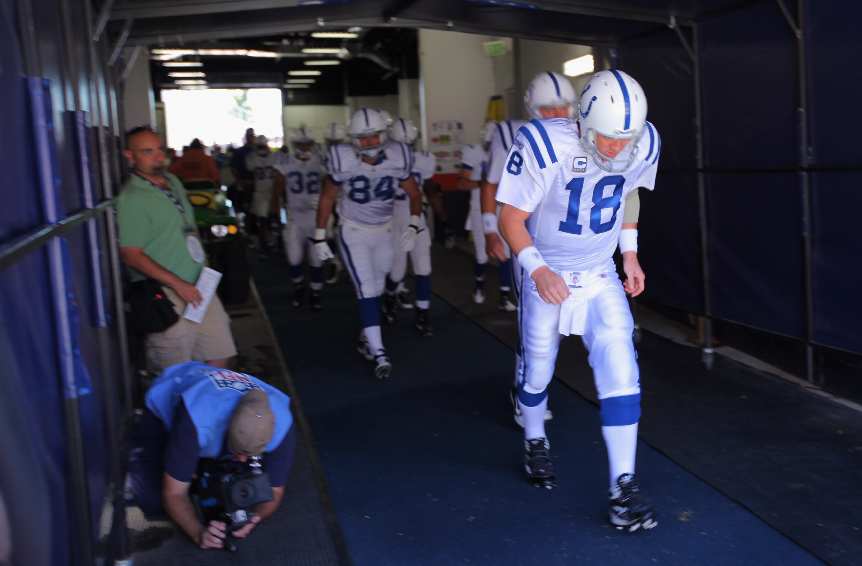 DENVER - SEPTEMBER 26:  Quarterback Peyton Manning #18 of the Indianapolis Colts leads his teammates onto the field to face the Denver Broncos at INVESCO Field at Mile High on September 26, 2010 in Denver, Colorado.  (Photo by Doug Pensinger/Getty Images)