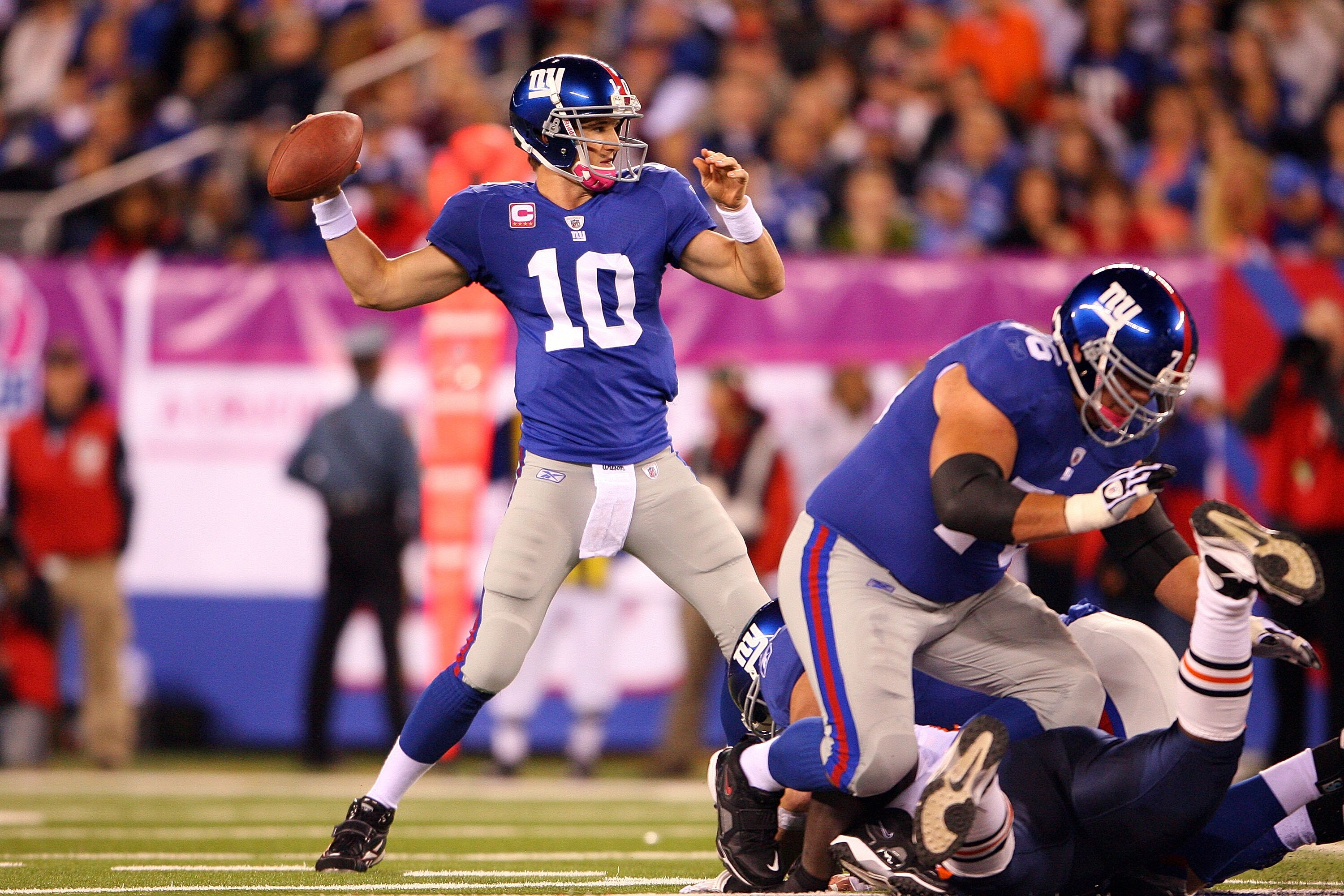 EAST RUTHERFORD, NJ - OCTOBER 03: Eli Manning #10 of the New York Giants drops back against the Chicago Bears at New Meadowlands Stadium on October 3, 2010 in East Rutherford, New Jersey. (Photo by Andrew Burton/Getty Images) EAST RUTHERFORD, NJ - OCTOBER 03: Eli Manning #10 of the New York Giants drops back against the Chicago Bears at New Meadowlands Stadium on October 3, 2010 in East Rutherford, New Jersey. (Photo by Andrew Burton/Getty Images)