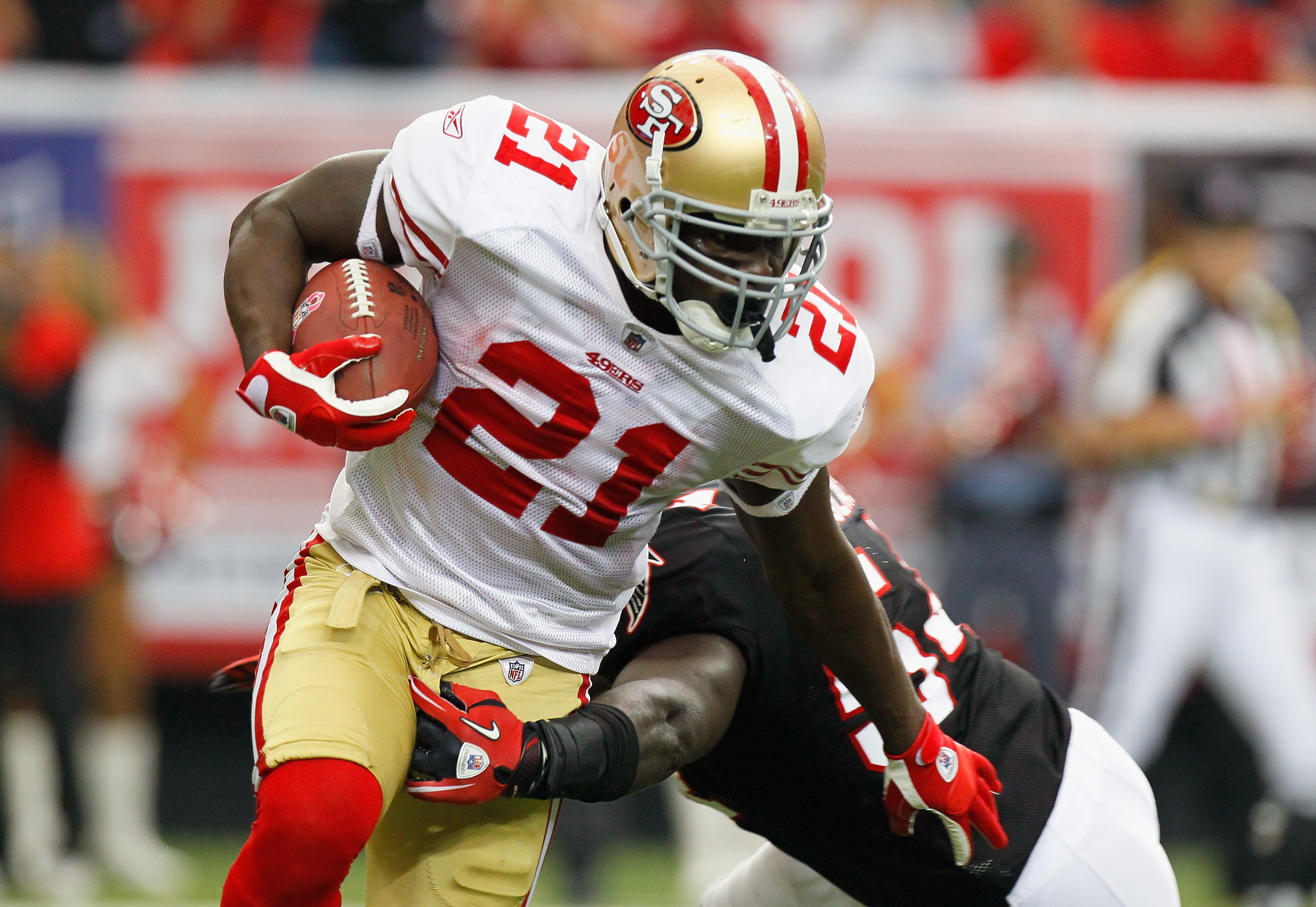 ATLANTA - OCTOBER 03: Frank Gore #21 of the San Francisco 49ers breaks a tackle by Stephen Nicholas #54 of the Atlanta Falcons at Georgia Dome on October 3, 2010 in Atlanta, Georgia. (Photo by Kevin C. Cox/Getty Images) ATLANTA - OCTOBER 03: Frank Gore #21 of the San Francisco 49ers breaks a tackle by Stephen Nicholas #54 of the Atlanta Falcons at Georgia Dome on October 3, 2010 in Atlanta, Georgia. (Photo by Kevin C. Cox/Getty Images)