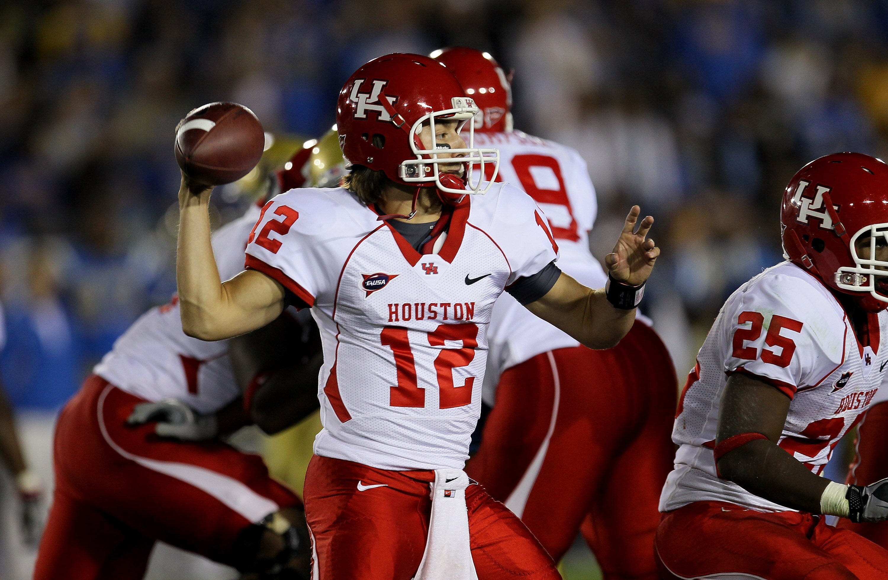 PASADENA, CA - SEPTEMBER 18:  Quarterback Cotton Turner #12 of the Houston Cougars throws a pass against the UCLA Bruins at the Rose Bowl on September 18, 2010 in Pasadena, California.  UCLA won 31-13.  (Photo by Stephen Dunn/Getty Images)