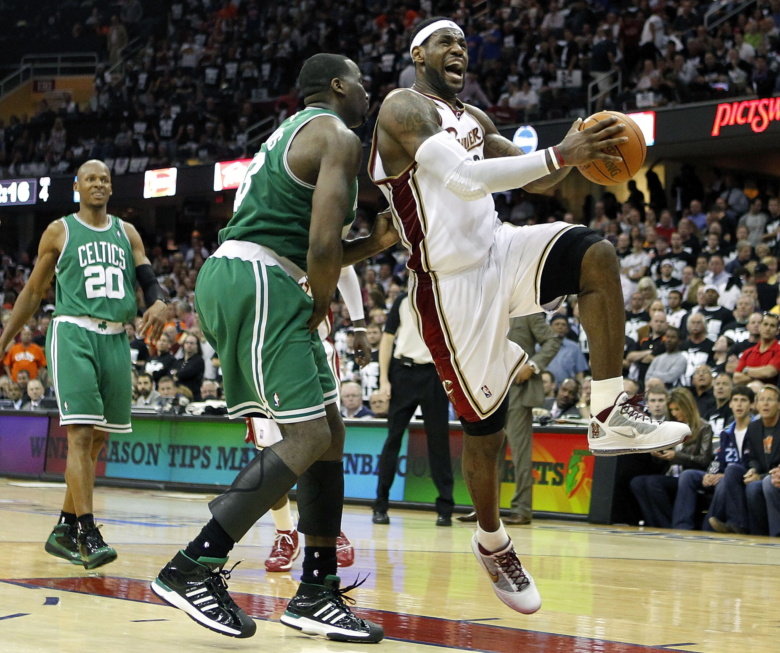 CLEVELAND - MAY 03:  LeBron James #23 of the Cleveland Cavaliers tries to get a shot off around Kendrick Perkins #43 of the Boston Celtics during Game Two of the Eastern Conference Semifinals during the 2010 NBA Playoffs at Quicken Loans Arena on May 3, 2