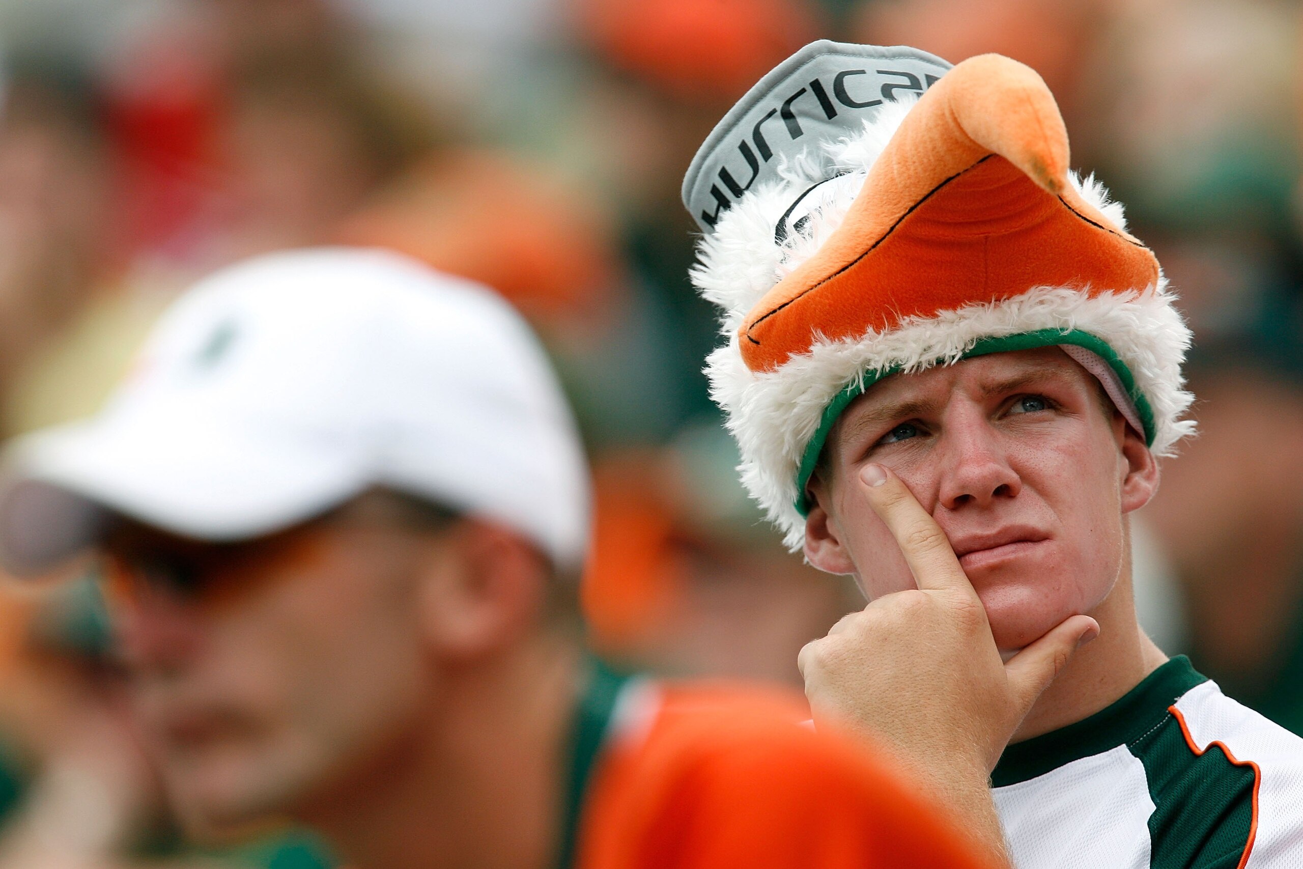 CHAPEL HILL, NC - OCTOBER 06:  A Miami Hurricanes' fan stares off dejected during the second half of the Hurricanes 33-27 loss to the North Carolina Tar Heels at Kenan Stadium on October 6, 2007 in Chapel Hill, North Carolina.  (Photo by Kevin C. Cox/Gett