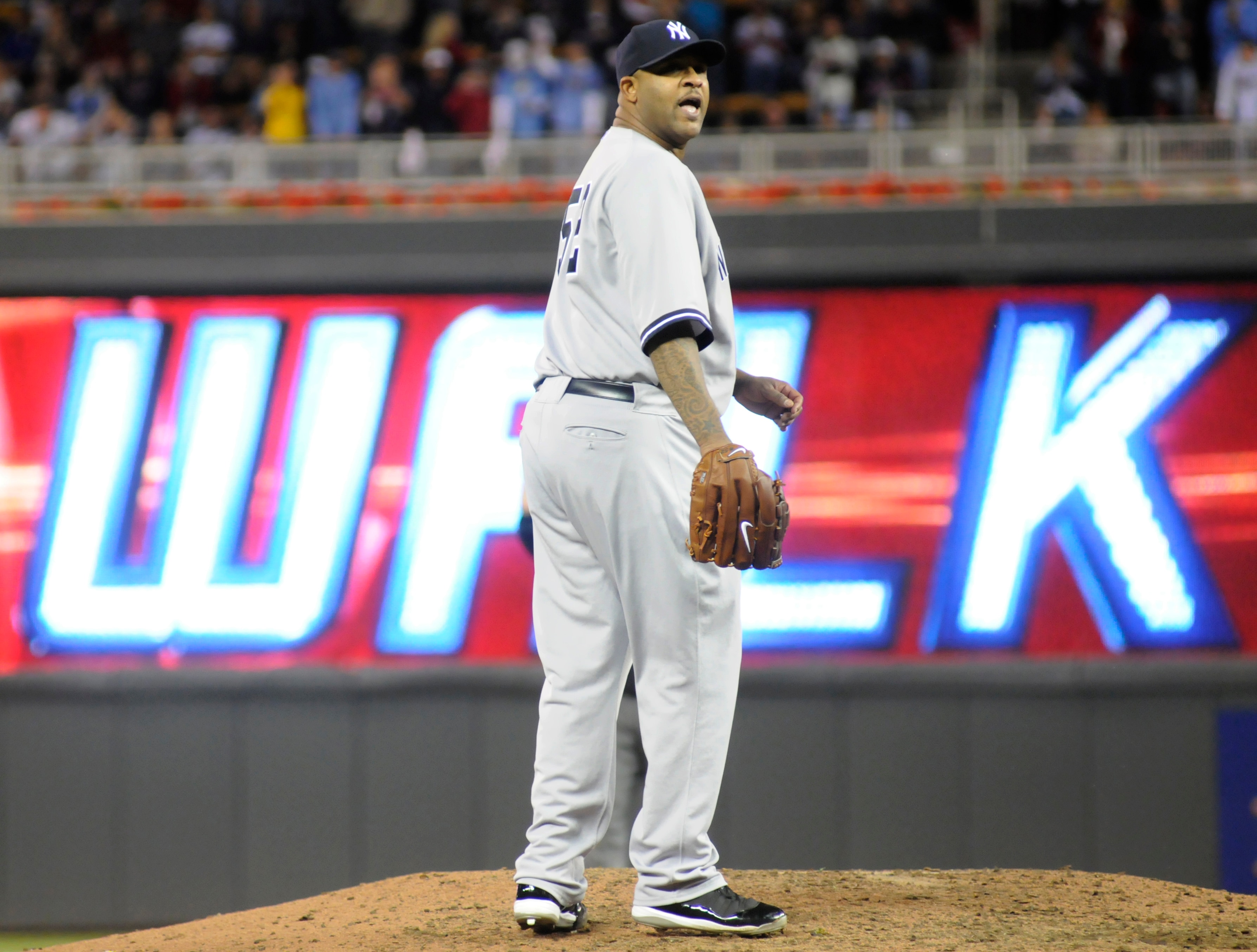 MINNEAPOLIS, MN - OCTOBER 6: CC Sabathia #52 of the New York Yankees reacts to giving up a walk to tie the game in the sixth inning during game one of the ALDS against the Minnesota Twins on October 6, 2010 at Target Field in Minneapolis, Minnesota. (Phot