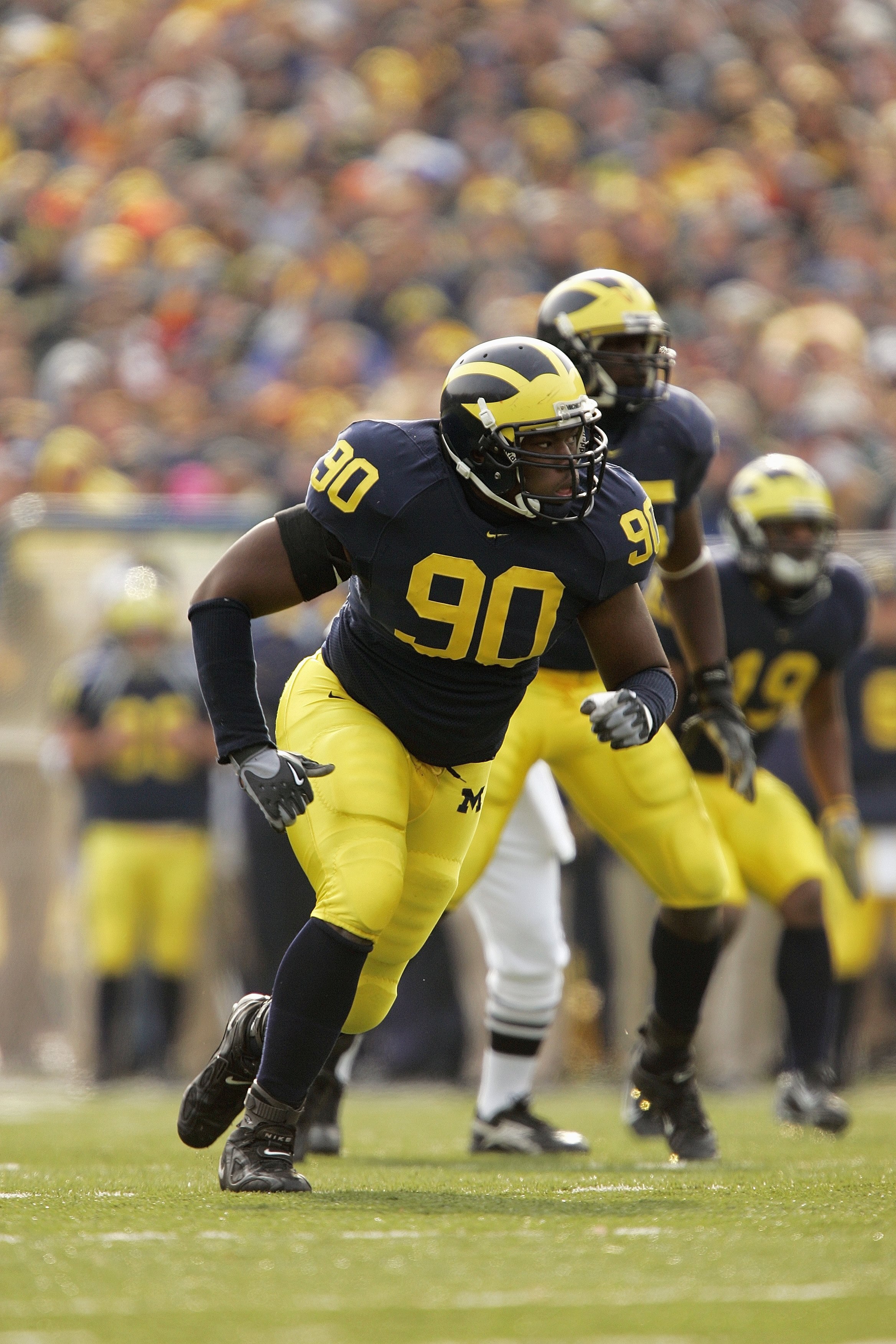 ANN ARBOR, MI - NOVEMBER 4:  Defensive ends Tim Jamison #90 of the Michigan Wolverines during the NCAA game against the Ball State Cardinals on November 4, 2006 at Michigan Stadium in Ann Arbor, Michigan. Michigan won 34-26. (Photo by Brian Bahr/Getty Ima