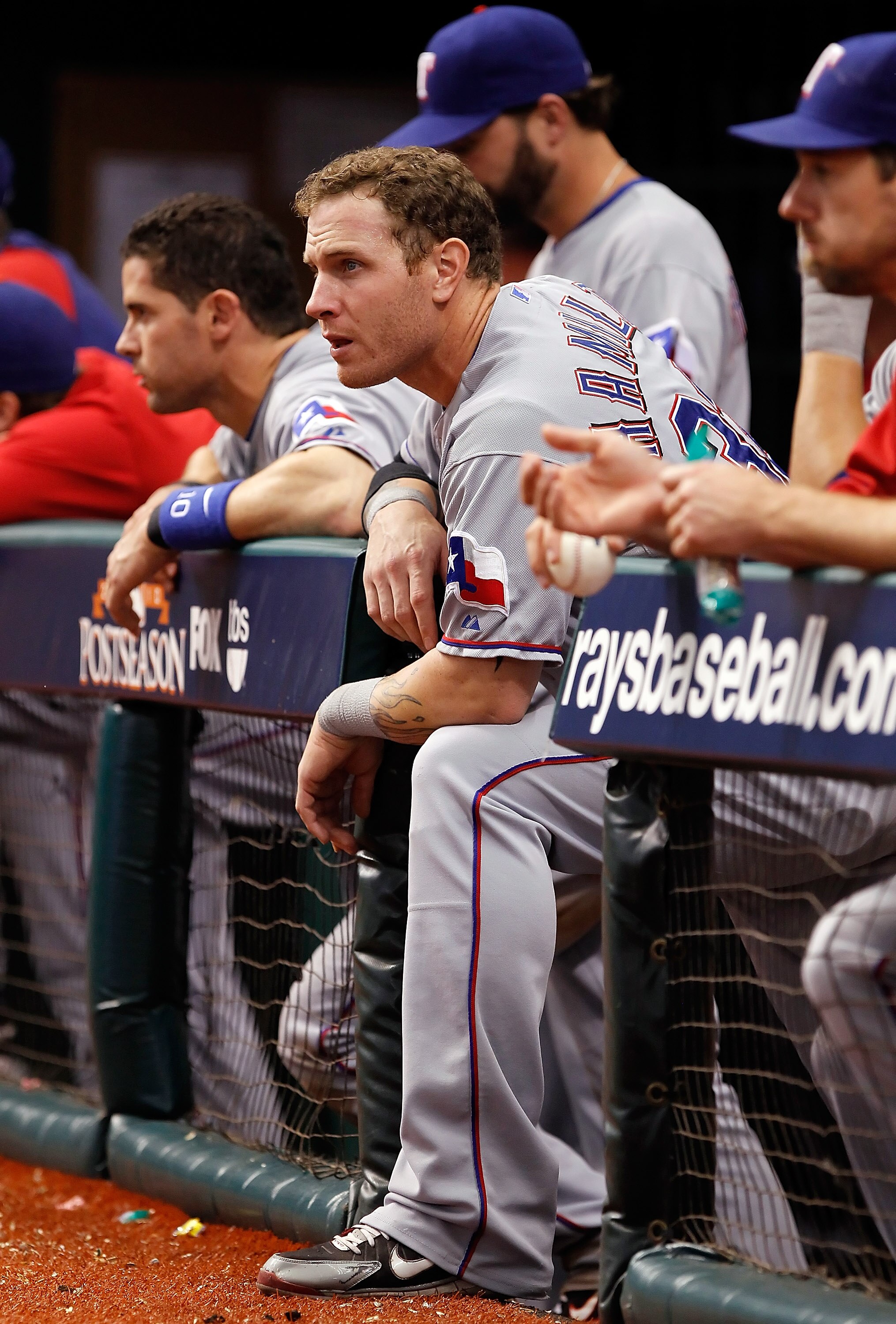 ST PETERSBURG, FL - OCTOBER 07:  Outfielder Josh Hamilton #32 of the Texas Rangers watches his team from the dugout against the Tampa Bay Rays during Game 2 of the ALDS at Tropicana Field on October 7, 2010 in St. Petersburg, Florida.  (Photo by J. Meric/