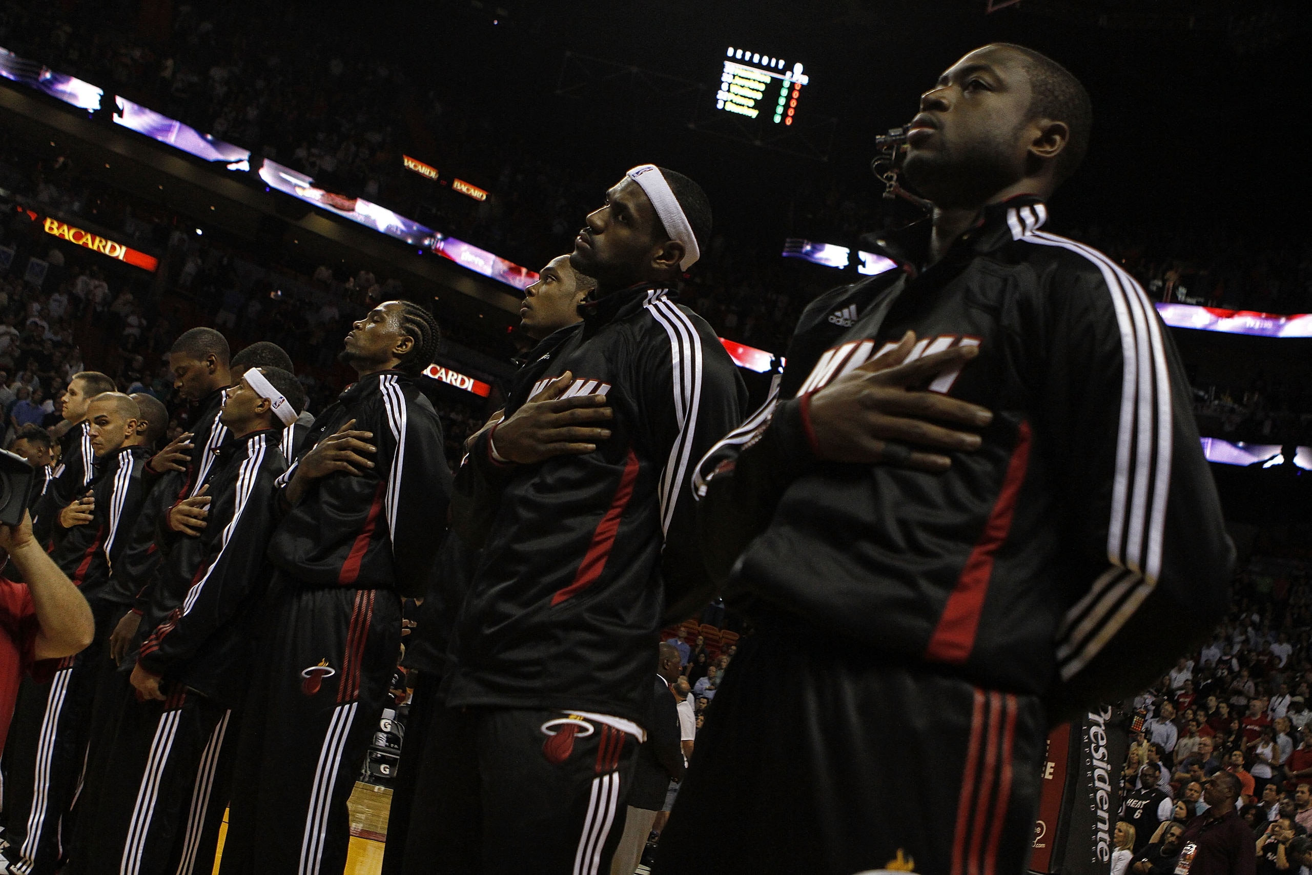 MIAMI - OCTOBER 05:  Forward LeBron James #6 (C) and teammate Dwyane Wade #3 (R) on the court before taking on the Detroit Pistons on October 5, 2010 in Miami, Florida.  NOTE TO USER: User expressly acknowledges and agrees that, by downloading and or usin