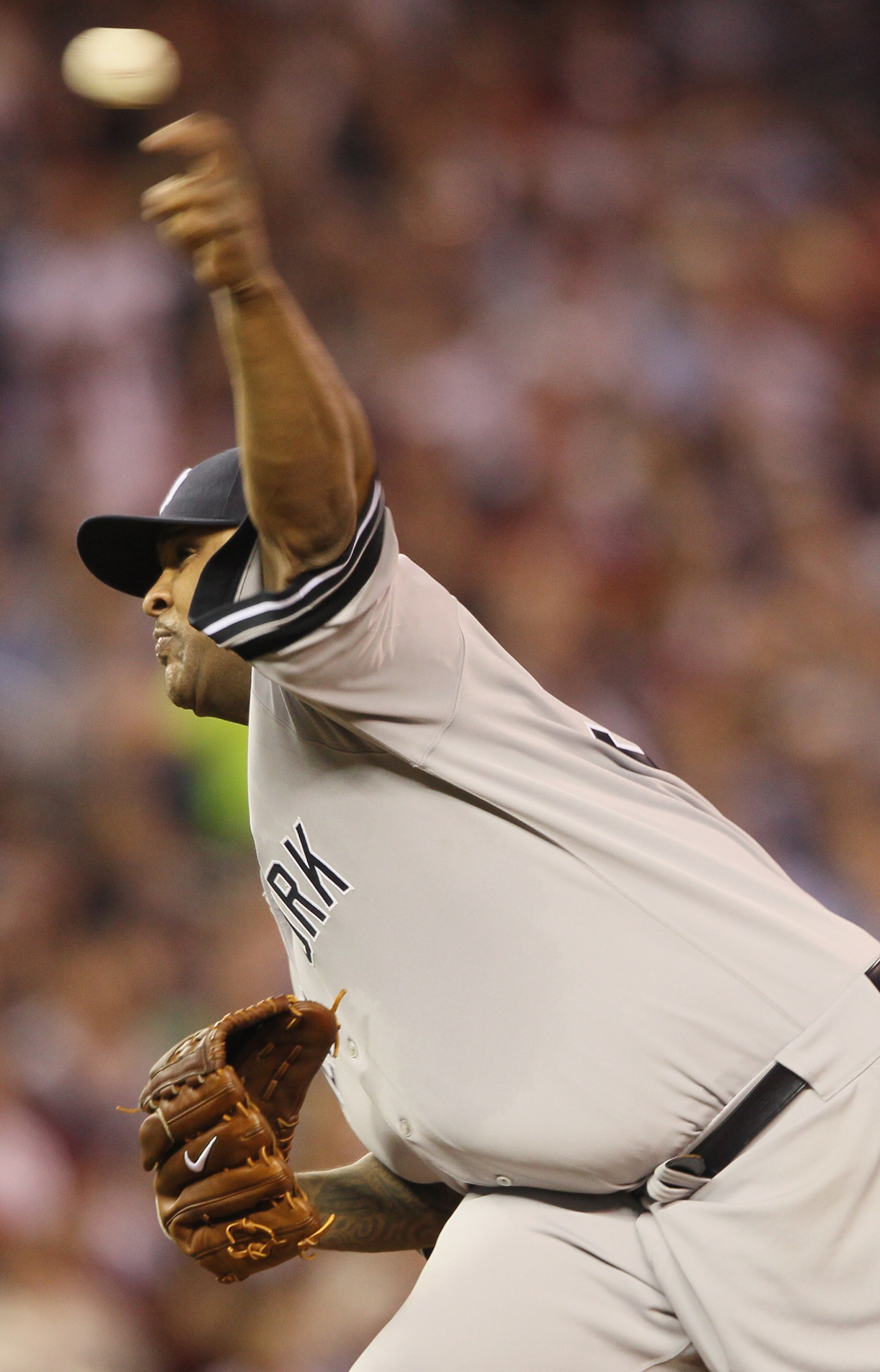 MINNEAPOLIS - OCTOBER 06:  CC Sabathia #52 of the New York Yankees delivers a pitch in the second inning against the Minnesota Twins during game one of the ALDS on October 6, 2010 at Target Field in Minneapolis, Minnesota.  (Photo by Elsa/Getty Images)