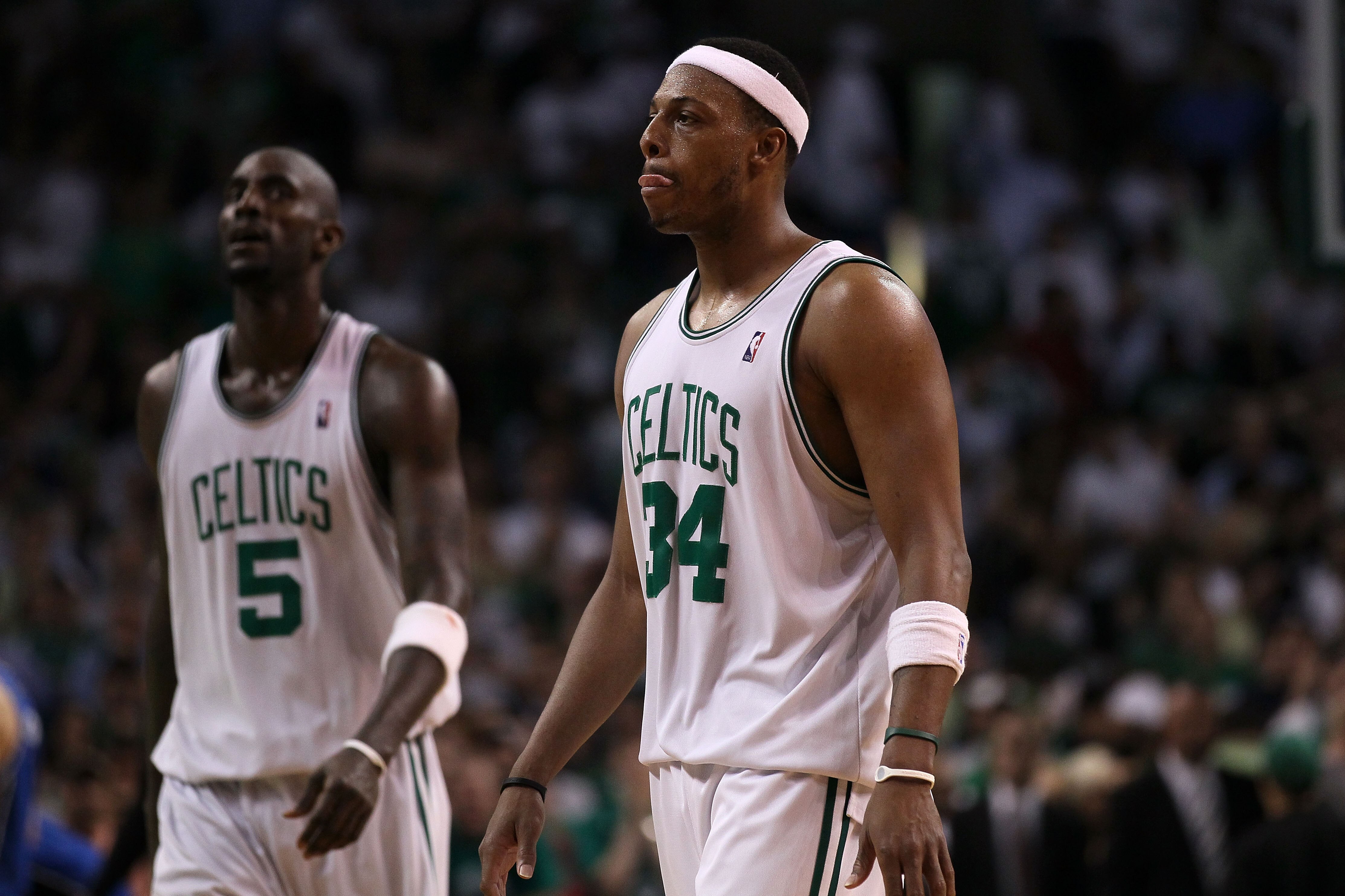 BOSTON - MAY 24:  Kevin Garnett #5 and Paul Pierce #34  of the Boston Celtics walks off after the Celtics lost 96-92 in overtime against the Orlando Magic in Game Four of the Eastern Conference Finals during the 2010 NBA Playoffs at TD Banknorth Garden on
