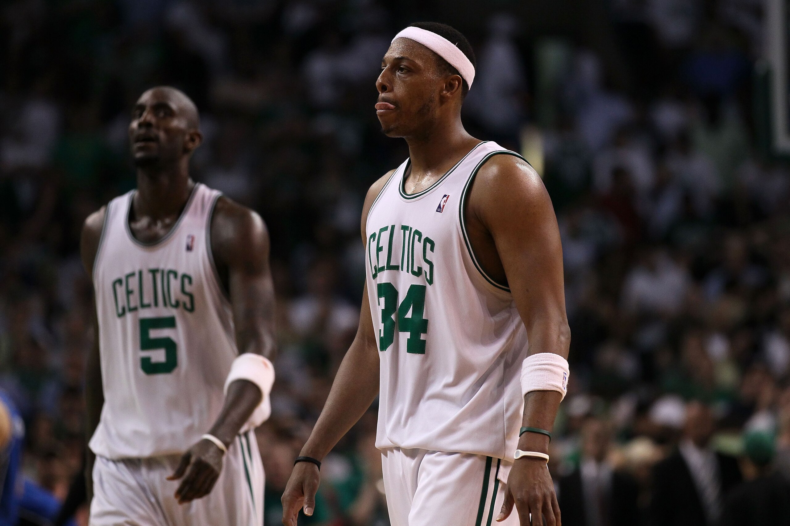 BOSTON - MAY 24:  Kevin Garnett #5 and Paul Pierce #34  of the Boston Celtics walks off after the Celtics lost 96-92 in overtime against the Orlando Magic in Game Four of the Eastern Conference Finals during the 2010 NBA Playoffs at TD Banknorth Garden on