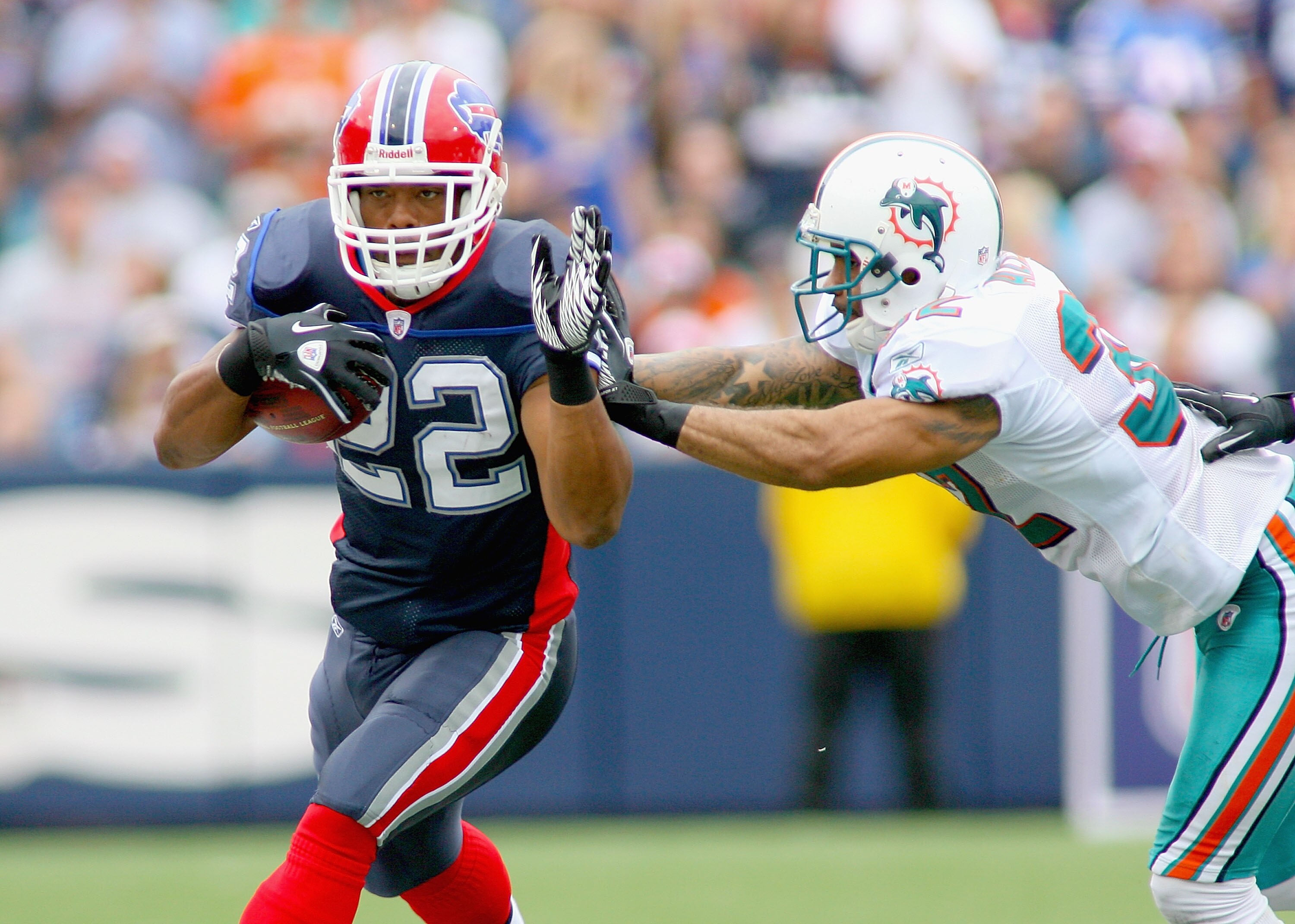 ORCHARD PARK, NY - SEPTEMBER 12: Fred Jackson #22 of the Buffalo Bills is forced out of bounds by Jason Allen #32 of the Miami Dolphins during the NFL season opener at Ralph Wilson Stadium on September 12, 2010 in Orchard Park, New York. Miami won 15-10. 