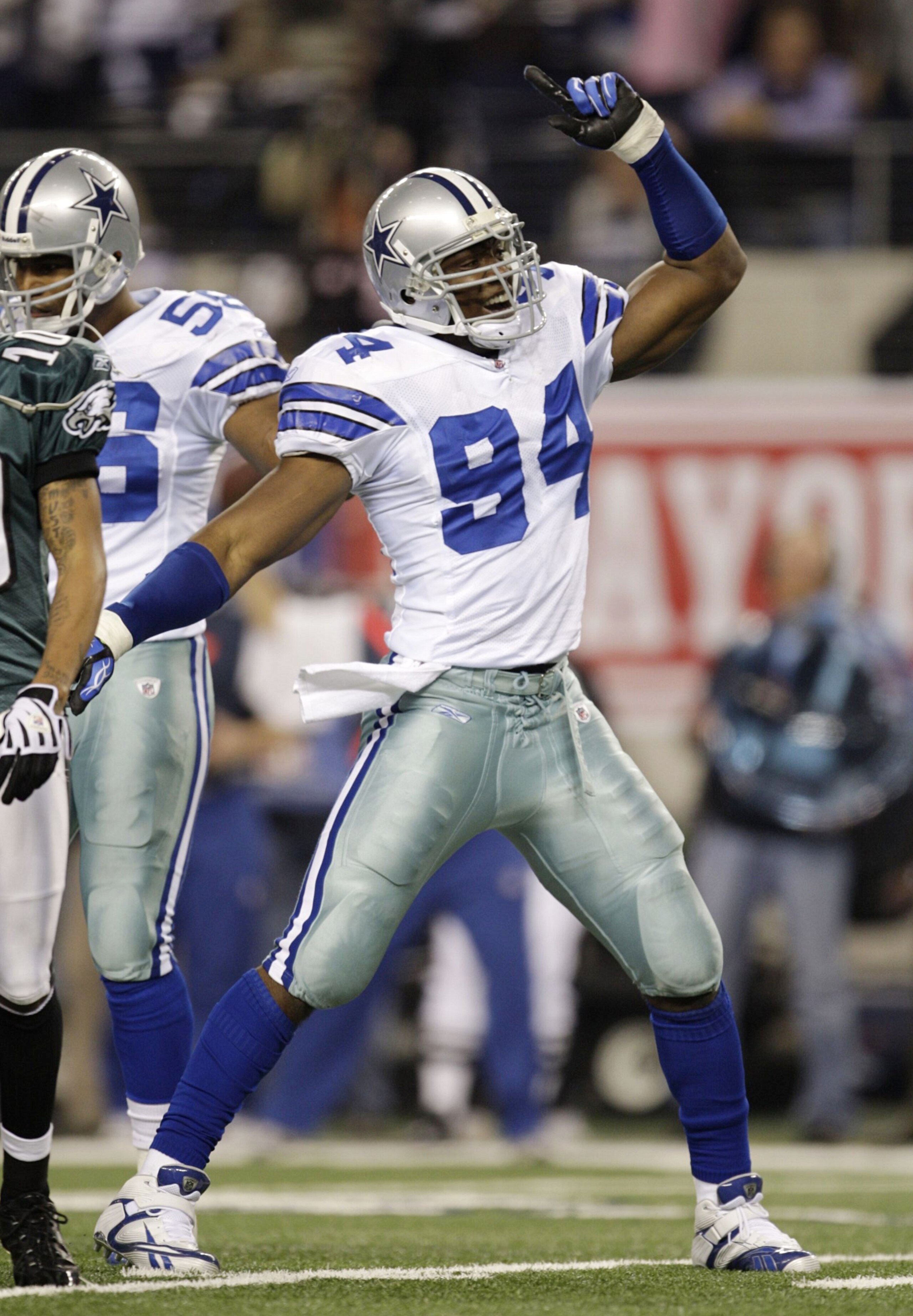 ARLINGTON, TX - JANUARY 9:  DeMarcus Ware #94 of the Dallas Cowboys reacts after the Cowboys recovered a second quarter fumble by Michael Vick #7 of the Philadelphia Eagles during the 2010 NFC wild-card playoff game at Cowboys Stadium on January 9, 2010 i