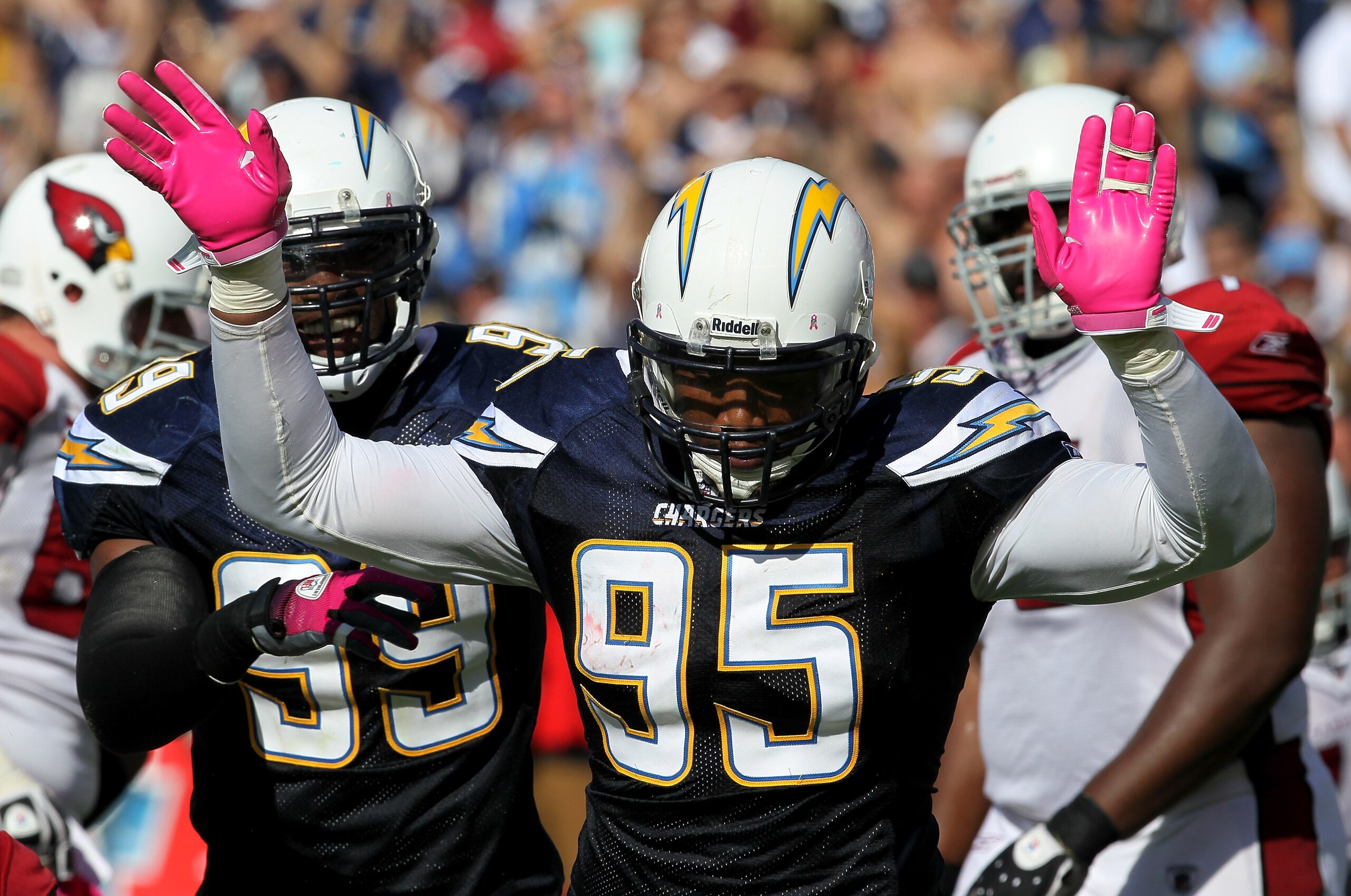 SAN DIEGO - OCTOBER 03:  Linebackers Shaun Phillips #95 and Kevin Burnett #99 of the San Diego Chargers celebrate a Phillips sack against the Arizona Cardinals at Qualcomm Stadium on October 3, 2010 in San Diego, California.   The Chargers won 41-10.  (Ph