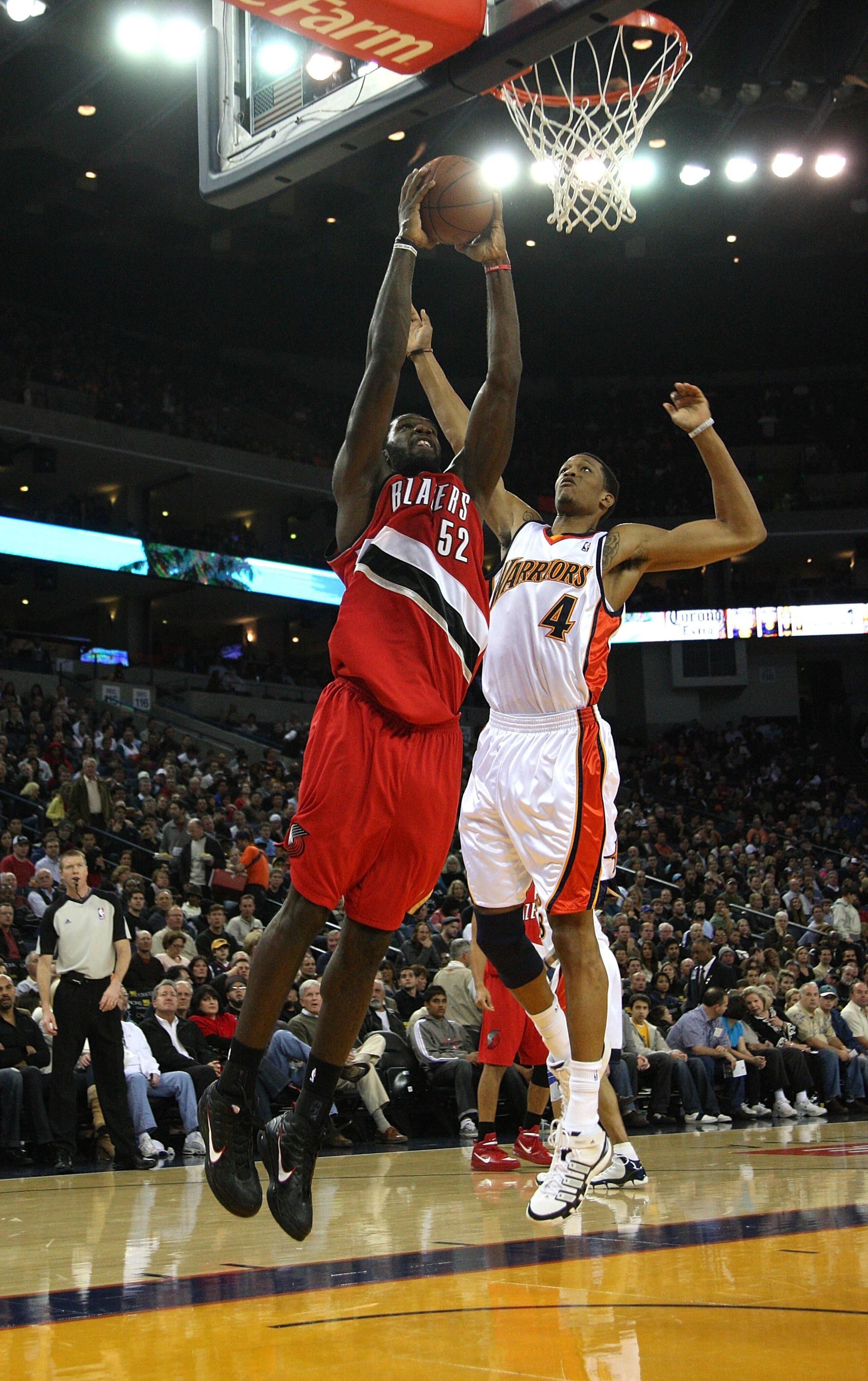 OAKLAND, CA - NOVEMBER 20:  Greg Oden #52 of the Portland Trail Blazers dunks over Anthony Randolph #4 of the Golden State Warriors during an NBA game at Oracle Arena on November 20, 2009 in Oakland, California.  (Photo by Jed Jacobsohn/Getty Images)