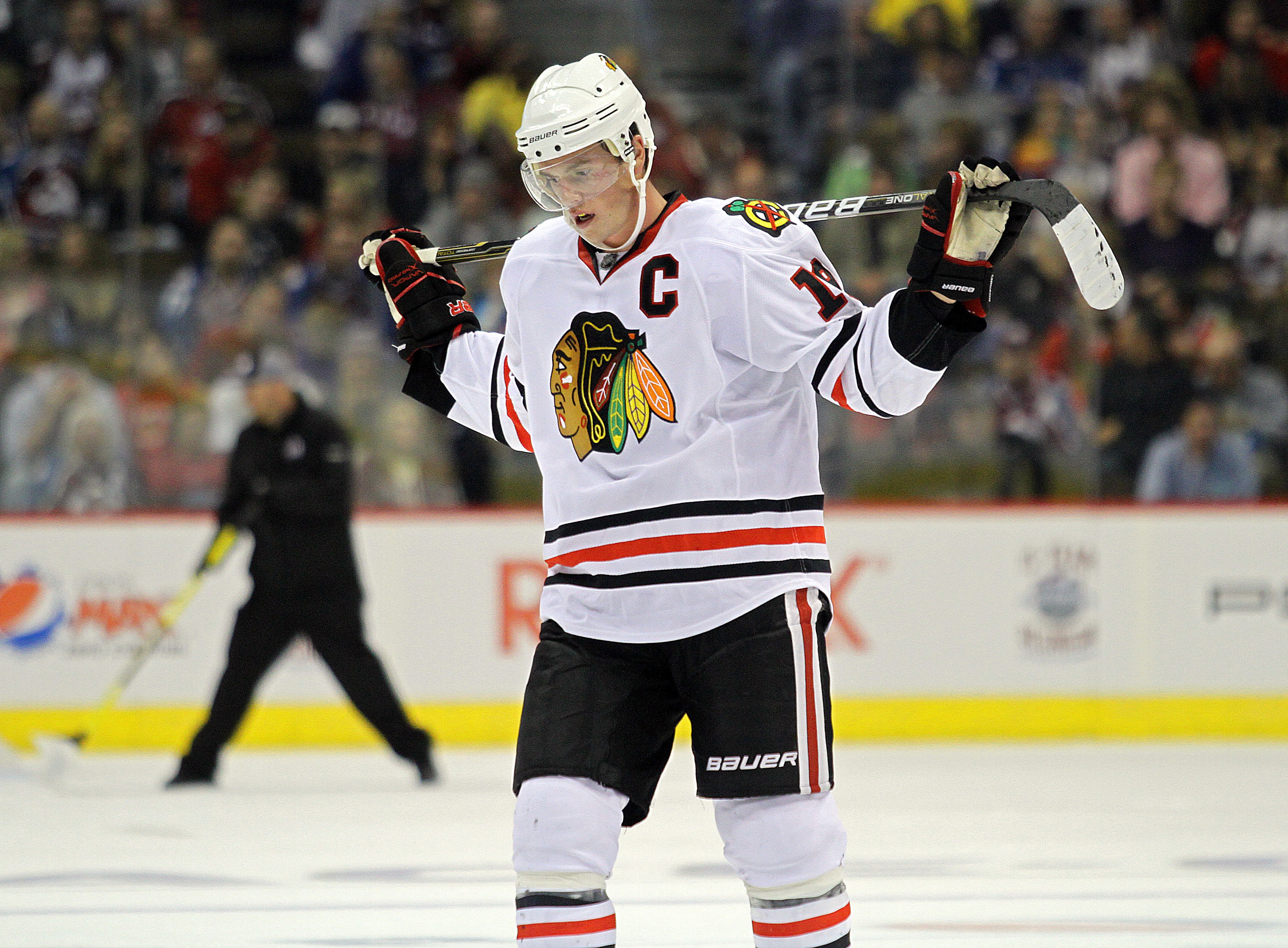 DENVER, CO - OCTOBER 7: Jonathan Toews #19 of the Chicago Blackhawks pauses during a break in the action in the second period against the Colorado Avalanche during both team's season openers at the Pepsi Center on October 7, 2010 in Denver, Colorado. (Pho