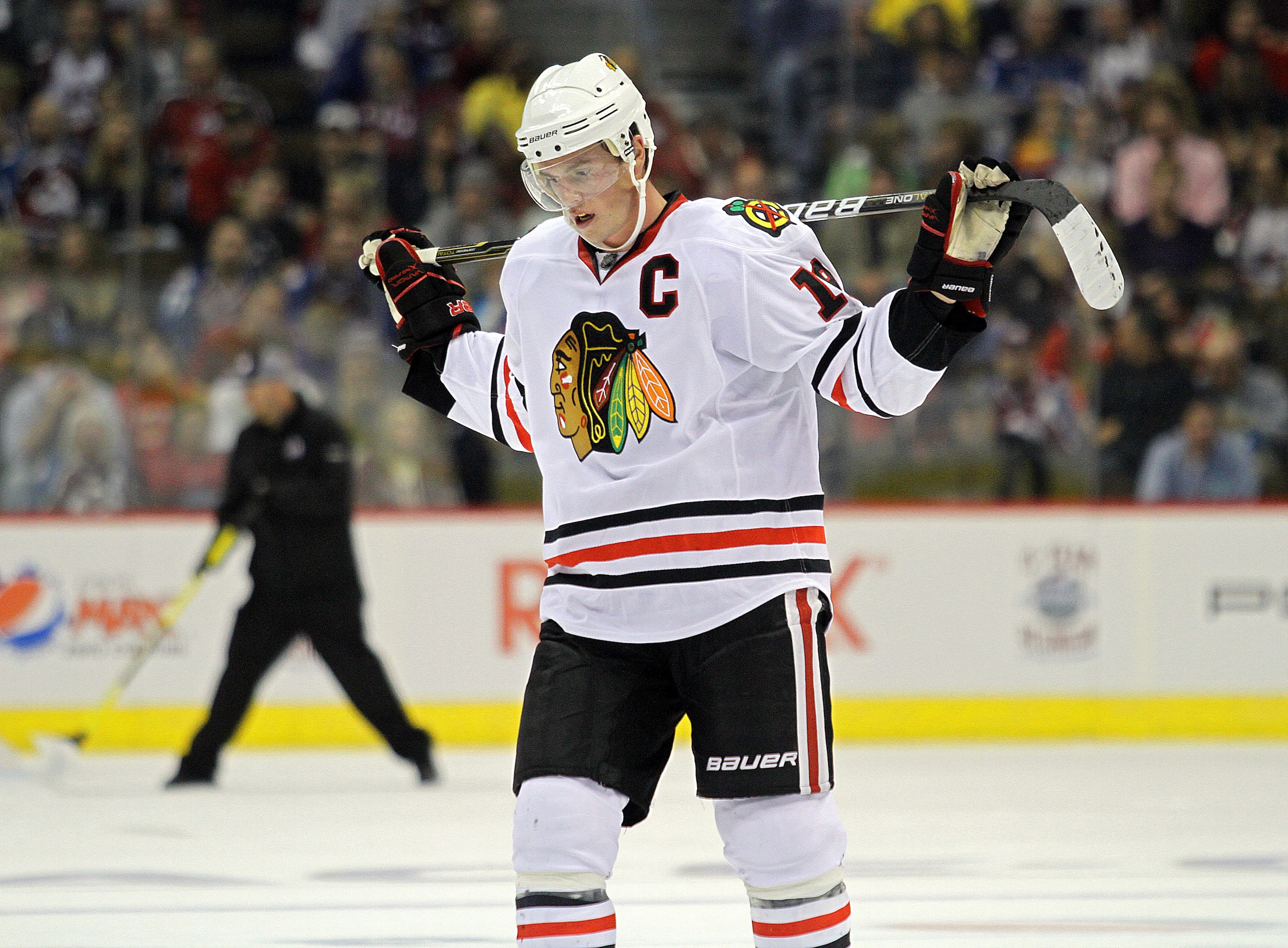 DENVER, CO - OCTOBER 7: Jonathan Toews #19 of the Chicago Blackhawks pauses during a break in the action in the second period against the Colorado Avalanche during both team's season openers at the Pepsi Center on October 7, 2010 in Denver, Colorado. (Pho