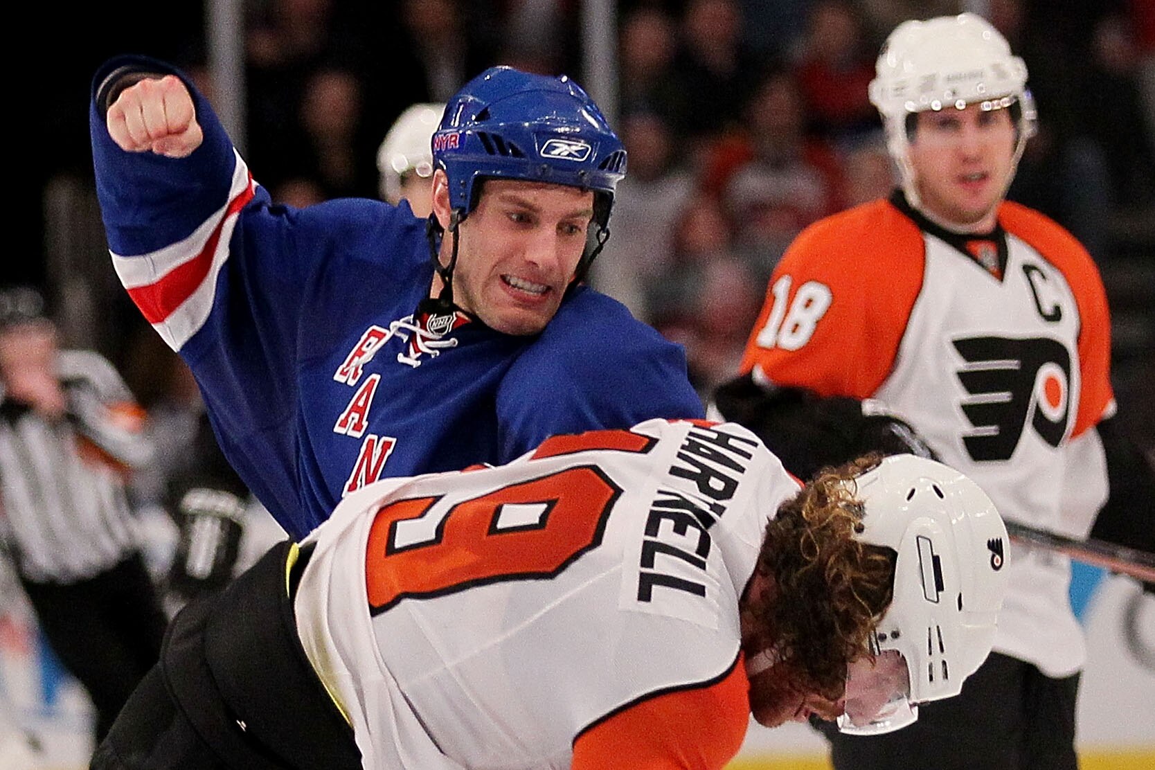 NEW YORK - APRIL 09:  Dan Girardi #5 of the New York Rangers fights with Scott Hartnell #19 of the Philadelphia Flyers during their game on April 9, 2010 at Madison Square Garden in New York City.  (Photo by Chris McGrath/Getty Images)
