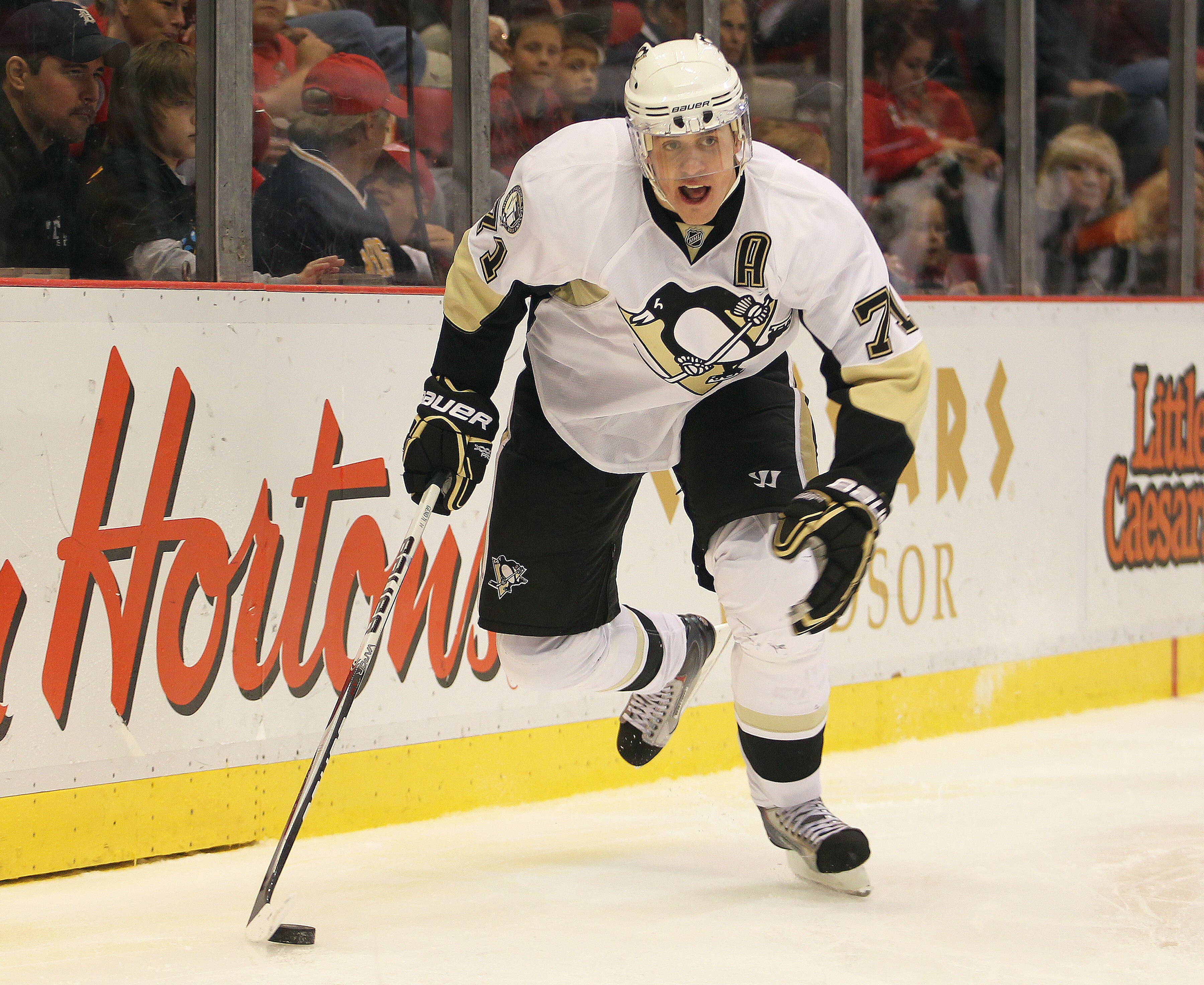 DETROIT, MI - OCTOBER 03:  Evgeni Malkin #71 of the Pittsburgh Penguins skates with the puck in a preseason game against the Detroit Red Wings on October 3, 2010 at the Joe Louis Arena in Detroit, Michigan. The Penguins defeated the Red Wings 5-2. (Photo 