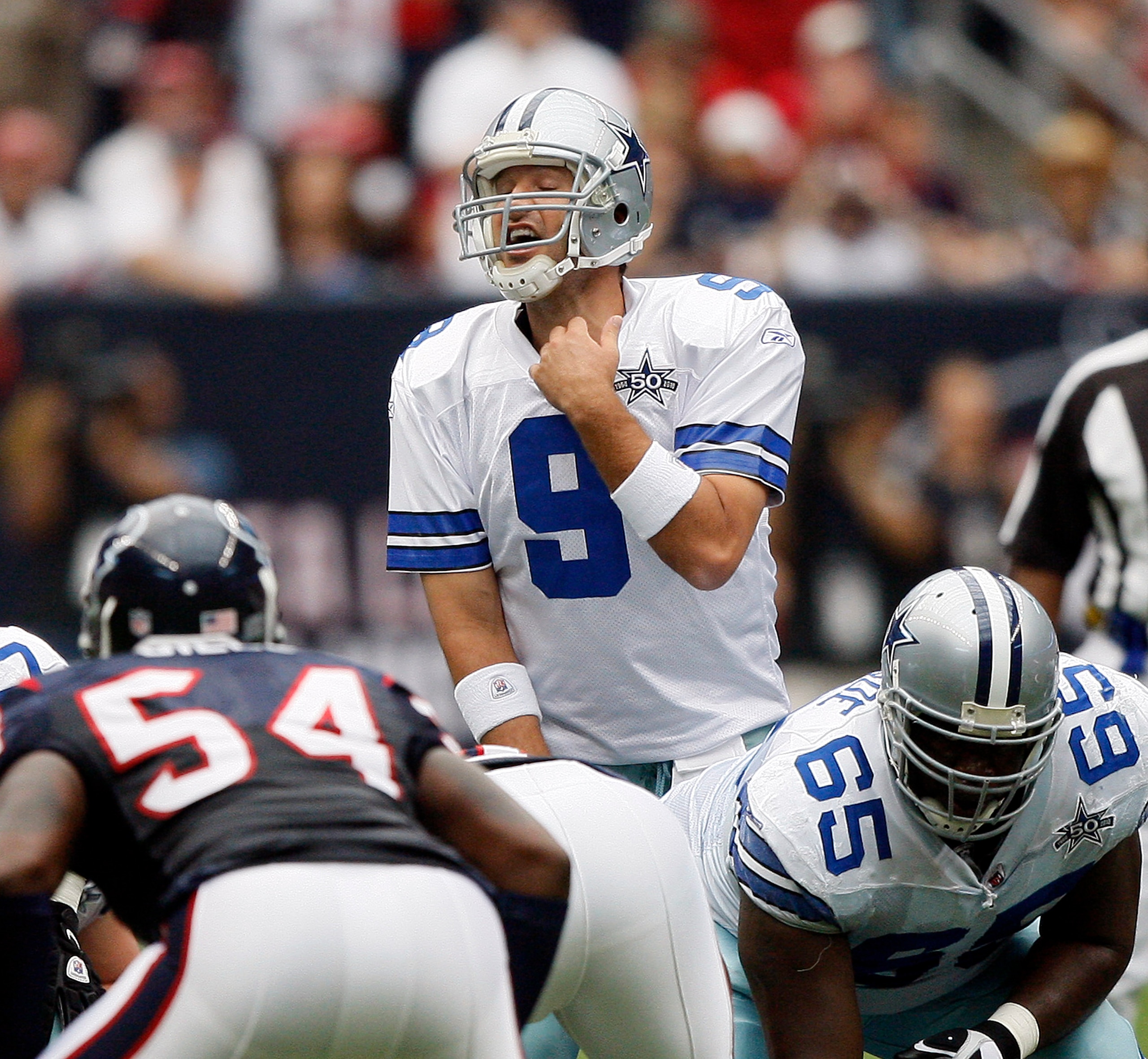 HOUSTON - SEPTEMBER 26:  Quarterback Tony Romo #9 of the Dallas Cowboys makes an adjustment at the line of scrimmage against the Houston Texans at Reliant Stadium on September 26, 2010 in Houston, Texas.  (Photo by Bob Levey/Getty Images)