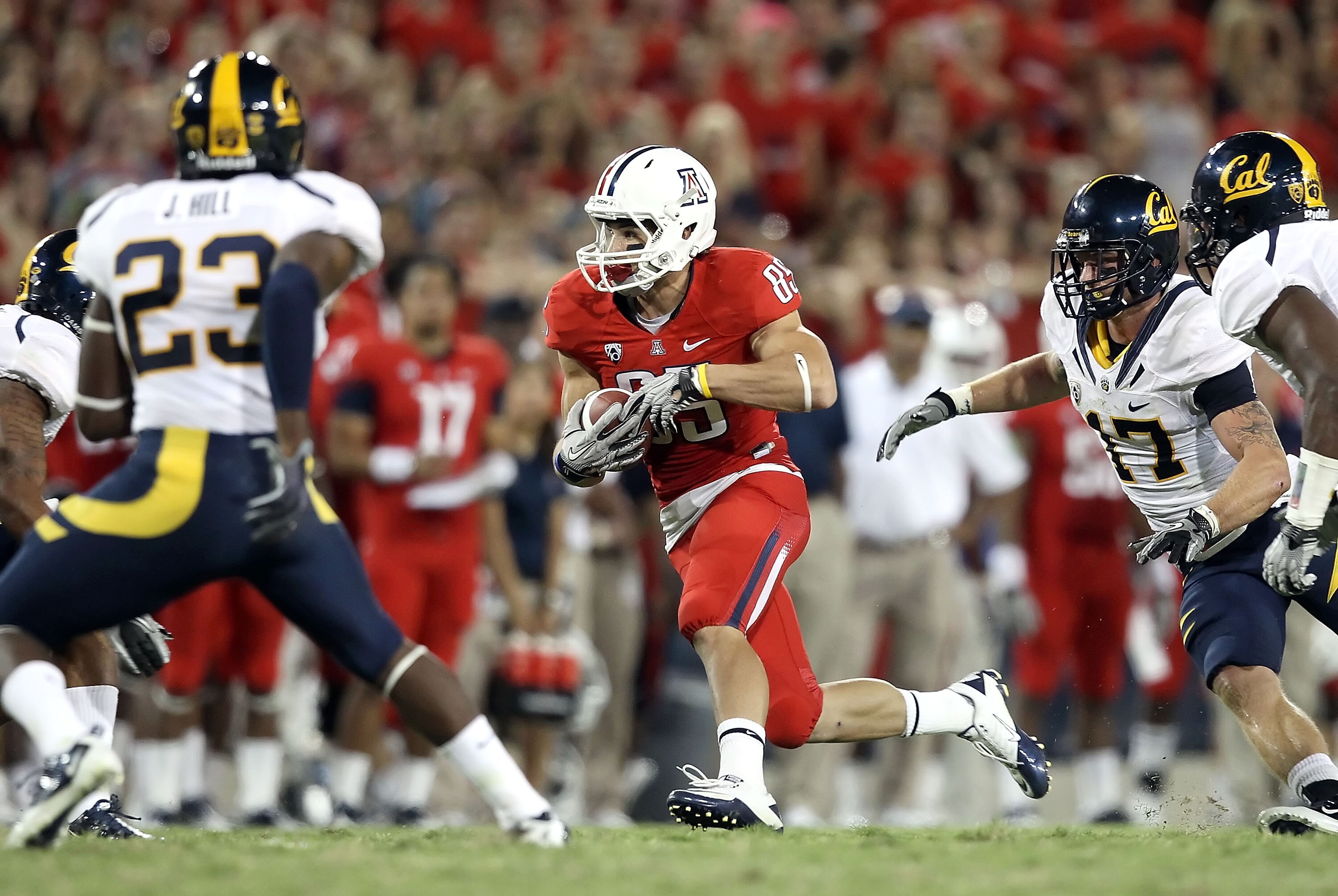 TUCSON, AZ - SEPTEMBER 25:  Wide receiver David Douglas #85 of the Arizona Wildcats runs with the football during the college football game against the California Golden Bears at Arizona Stadium on September 25, 2010 in Tucson, Arizona.   The Wildcats def