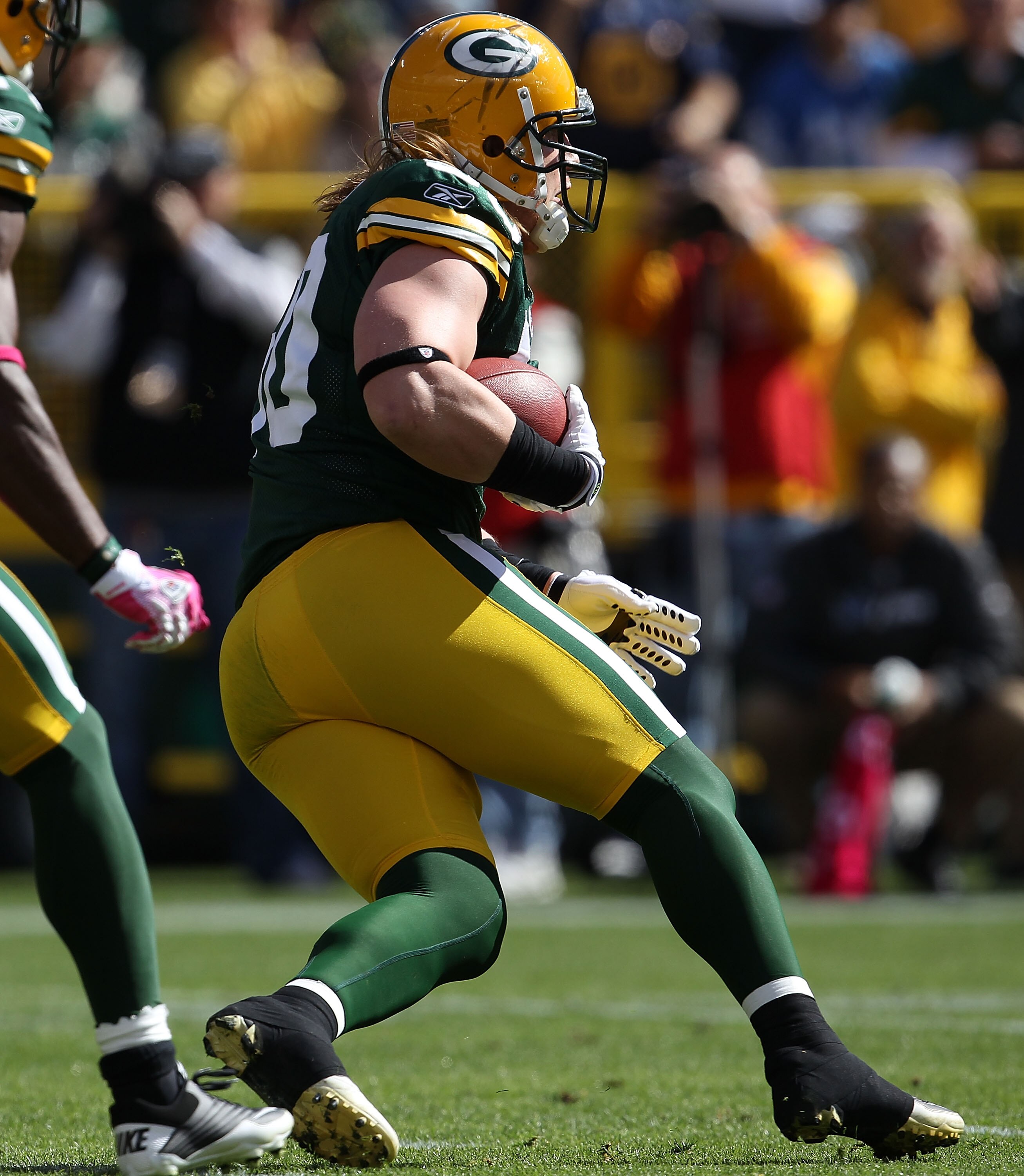 GREEN BAY, WI - OCTOBER 03: A.J. Hawk #50 of the Green Bay Packers runs after intercepting a pass against the Detroit Lions at Lambeau Field on October 3, 2010 in Green Bay, Wisconsin. The Packers defeated the Lions 28-26. (Photo by Jonathan Daniel/Getty