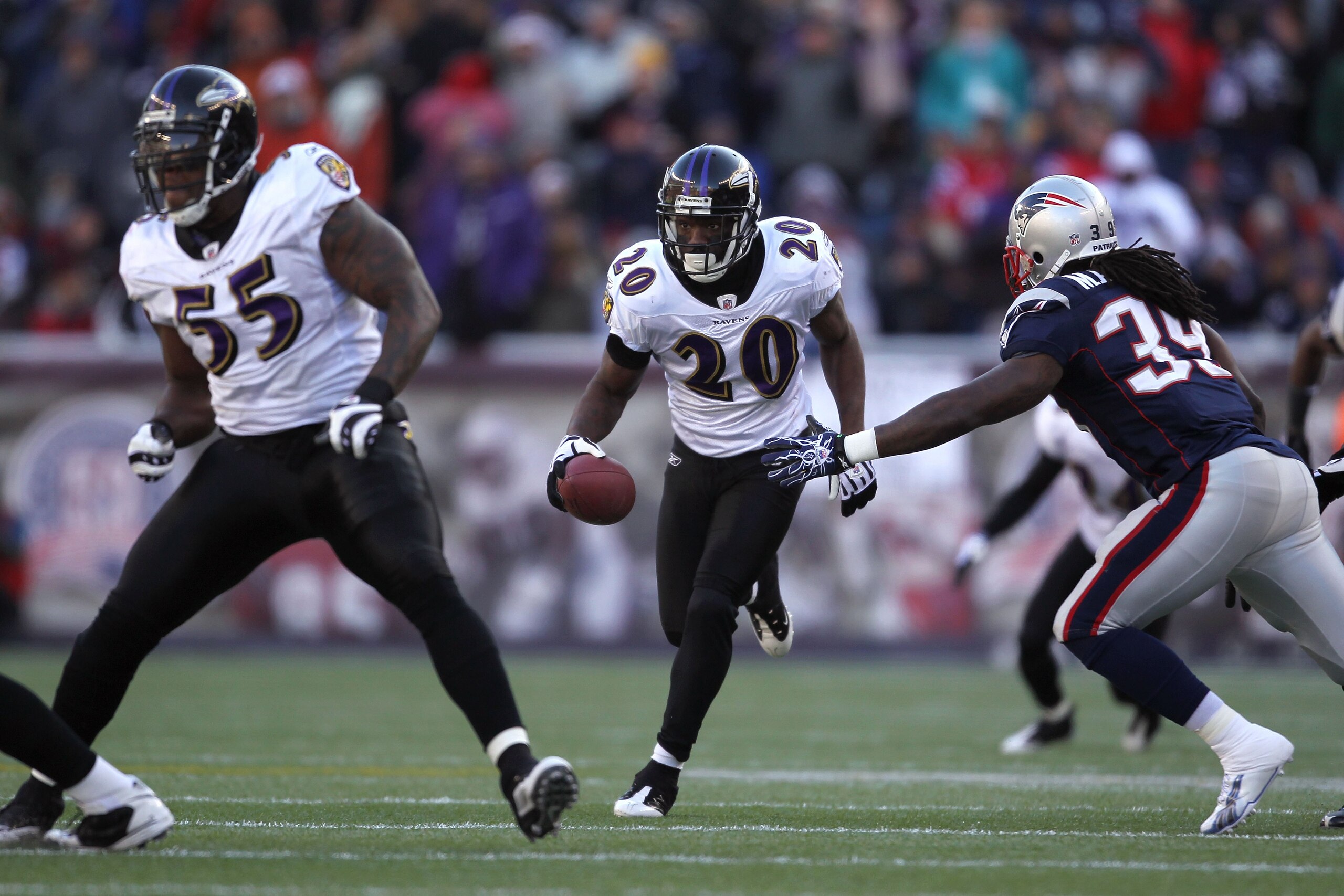 FOXBORO, MA - JANUARY 10:  Ed Reed #20 of the Baltimore Ravens intercepts a pass in the first quarter against the New England Patriots during the 2010 AFC wild-card playoff game at Gillette Stadium on January 10, 2010 in Foxboro, Massachusetts. The Ravens