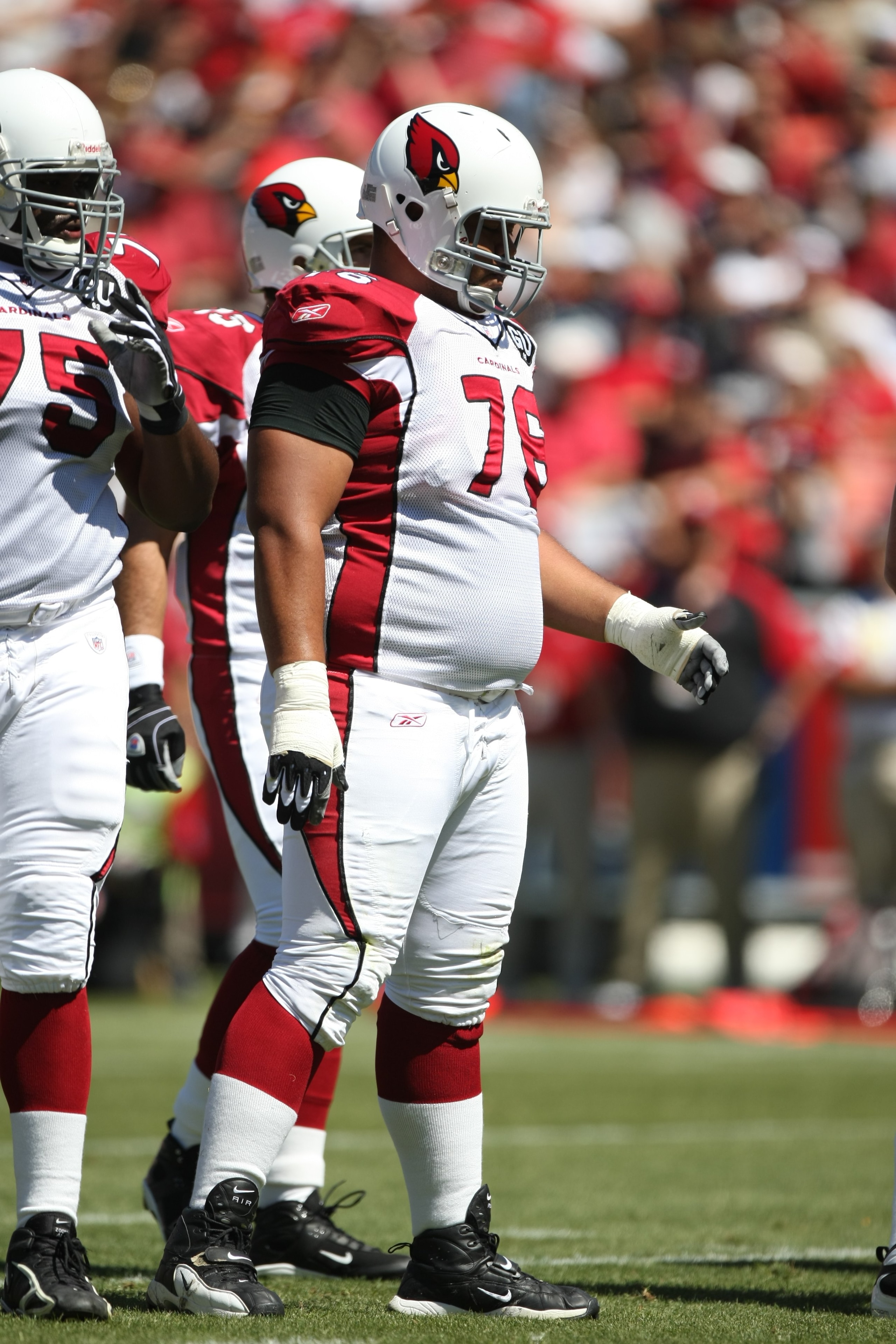 SAN FRANCISCO - SEPTEMBER 7:  Deuce Lutui #76 of the Arizona Cardinals stands at the line of scrimmage during the game against the San Francisco 49ers on September 7, 2008 at Bill Walsh Field at Candlestick Park in San Francisco, California. (Photo by Jed