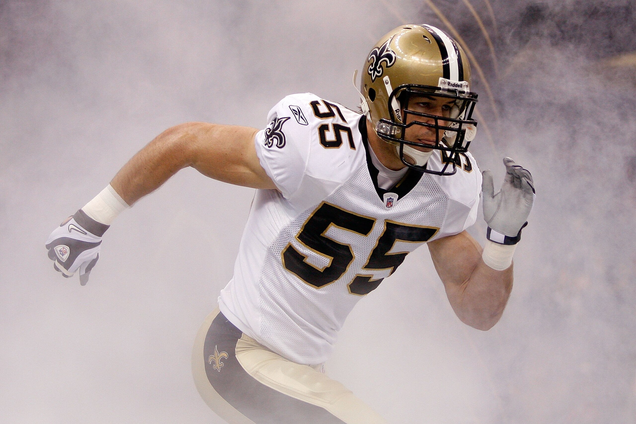 NEW ORLEANS - OCTOBER 18:  Scott Fujita #55 of the New Orleans Saints runs onto the field after being introduced prior to playing the New York Giants at the Louisiana Superdome on October 18, 2009 in New Orleans, Louisiana.  (Photo by Chris Graythen/Getty