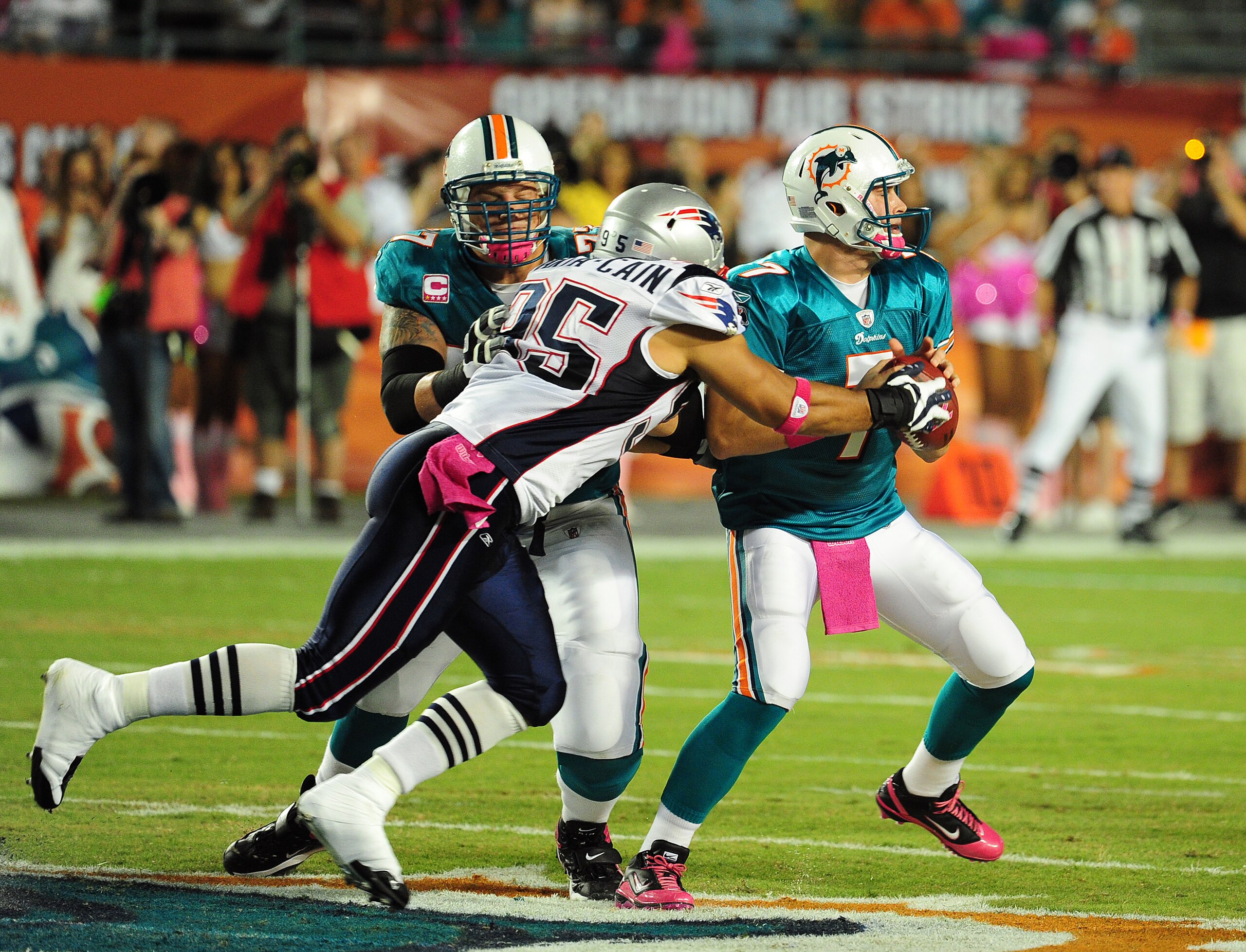 MIAMI - OCTOBER 4: Chad Henne #7 of the Miami Dolphins is pressured by Tully Banta-Cain #95 of the New England Patriots at Sun Life Field on October 4, 2010 in Miami, Florida. (Photo by Scott Cunningham/Getty Images)