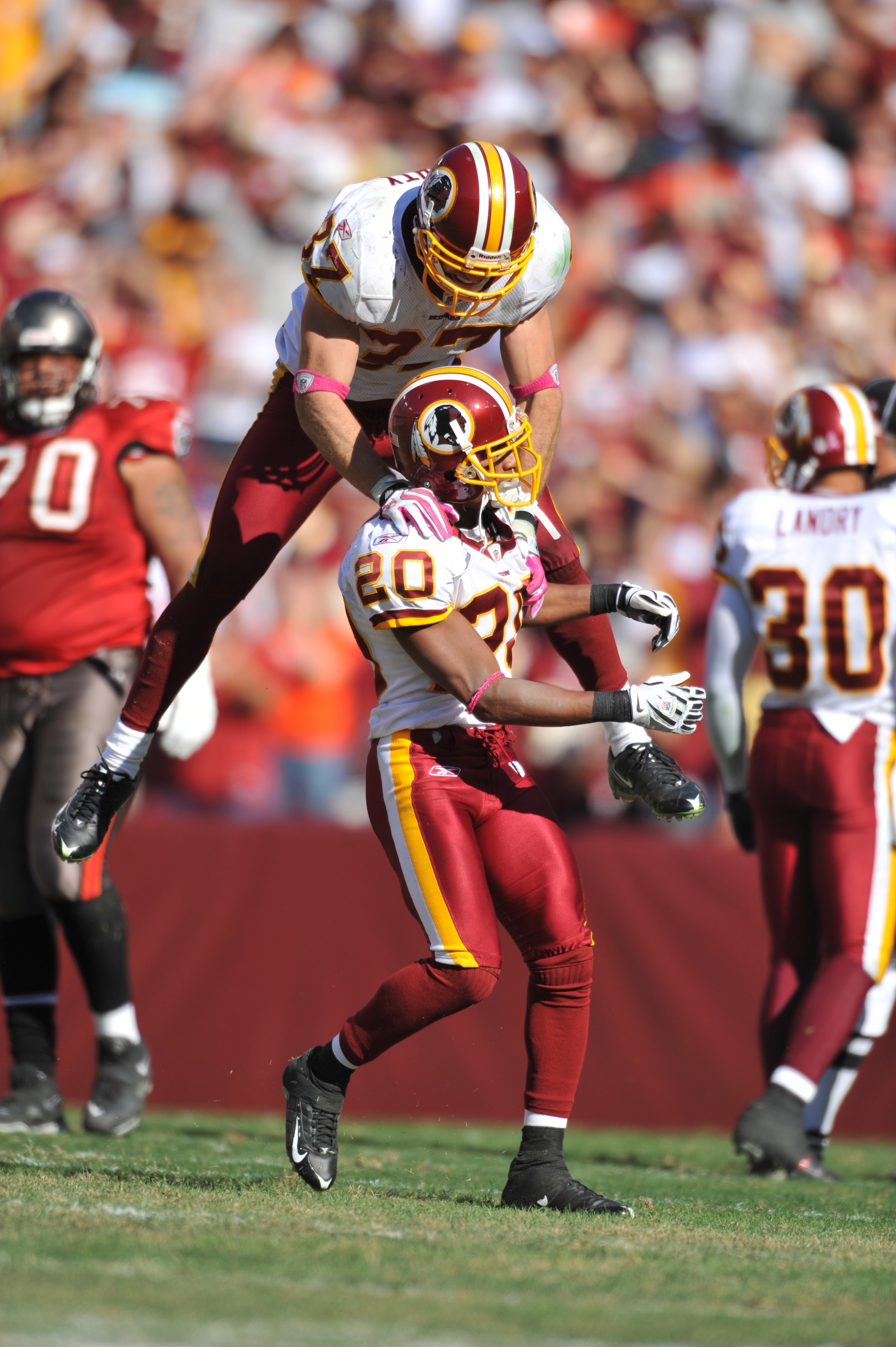 LANDOVER, MD - OCTOBER 4:  Reed Doughty #37 of the Washington Redskins celebrates a touchdown with Justin Tryon #20 against the Tampa Bay Buccaneers at FedExField on October 4, 2009 in Landover, Maryland. The Redskins defeated the Buccaneers 16-13. (Photo