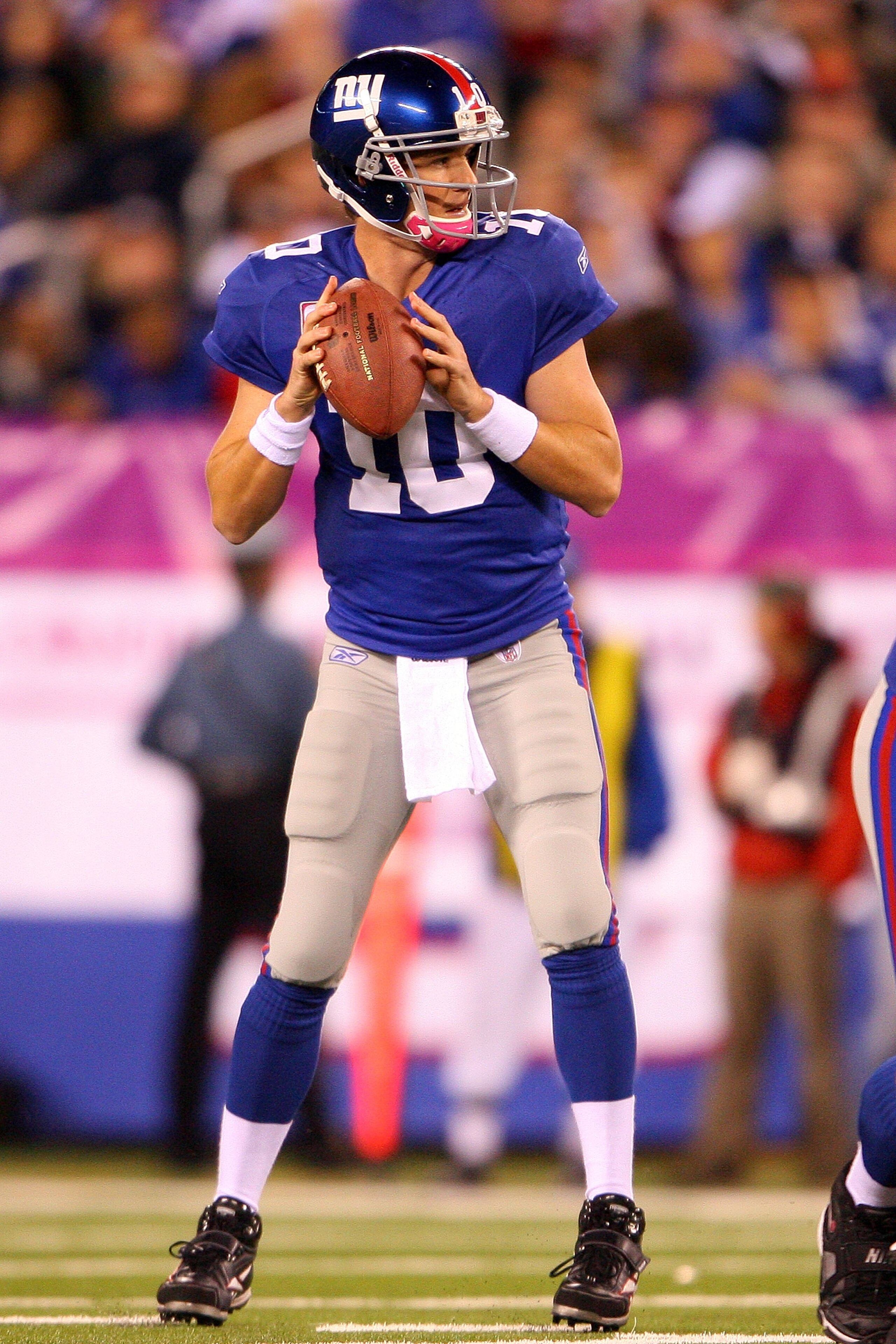 EAST RUTHERFORD, NJ - OCTOBER 03:  Eli Manning #10 of the New York Giants drops back against the Chicago Bears at New Meadowlands Stadium on October 3, 2010 in East Rutherford, New Jersey.  (Photo by Andrew Burton/Getty Images)