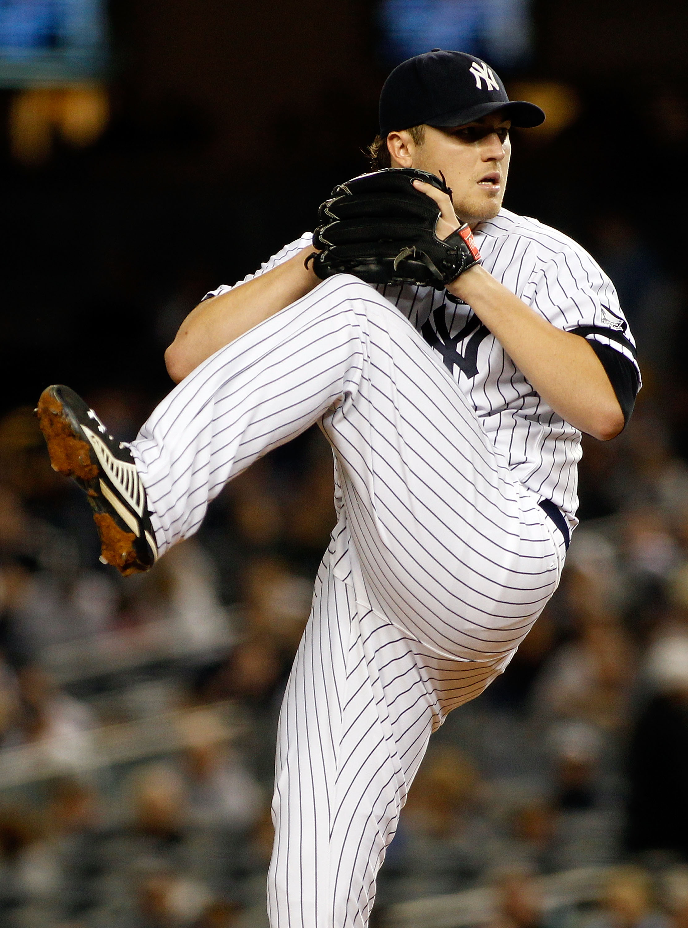 NEW YORK - SEPTEMBER 26:  Phil Hughes #65 of the New York Yankees delivers a pitch in the first-inning against the Boston Red Sox on September 26, 2010 at Yankee Stadium in the Bronx borough of New York City.  (Photo by Mike Stobe/Getty Images)