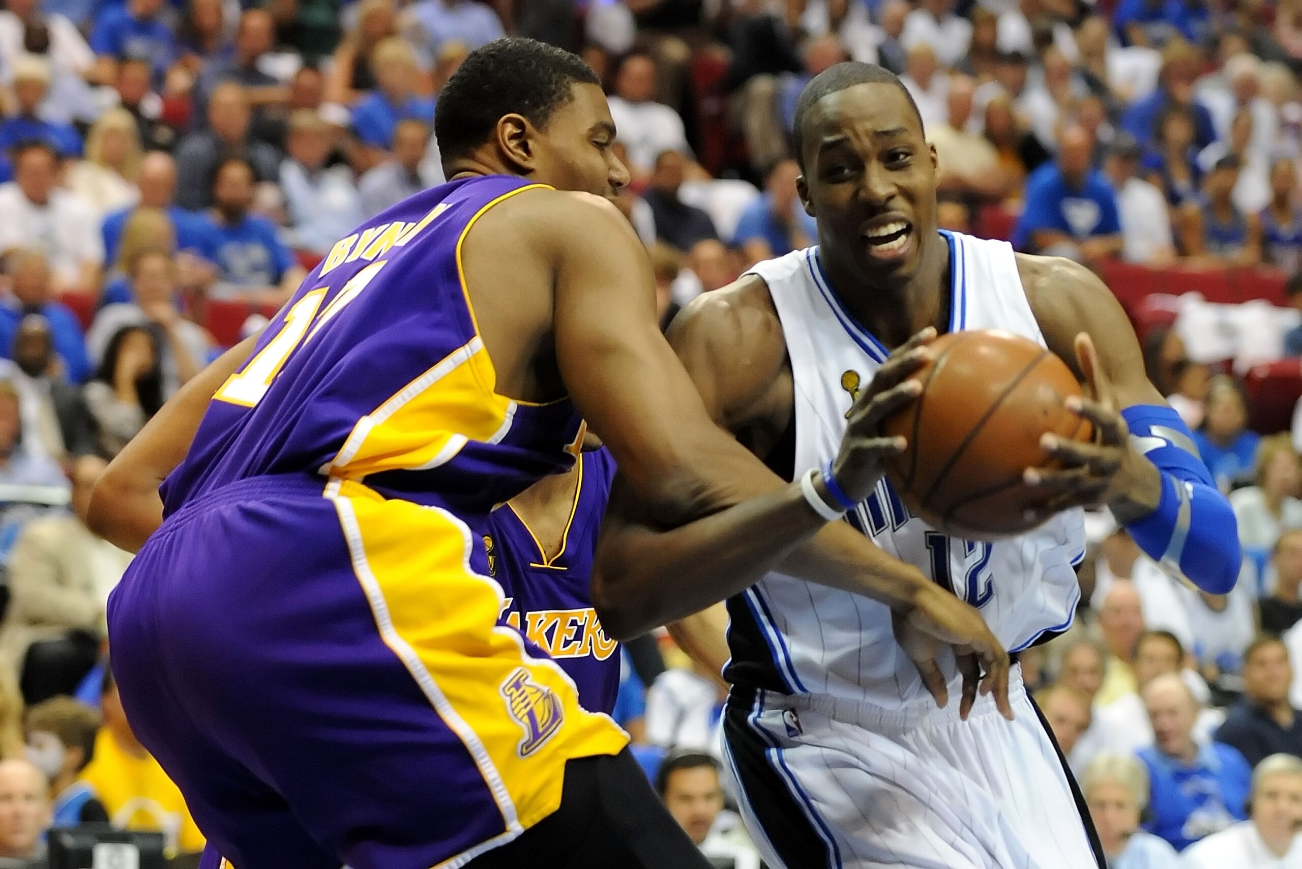 ORLANDO, FL - JUNE 14:  Dwight Howard #12 of the Orlando Magic drives on Andrew Bynum #17 of the Los Angeles Lakers in the third quarter of Game Five of the 2009 NBA Finals on June 14, 2009 at Amway Arena in Orlando, Florida.  NOTE TO USER:  User expressl