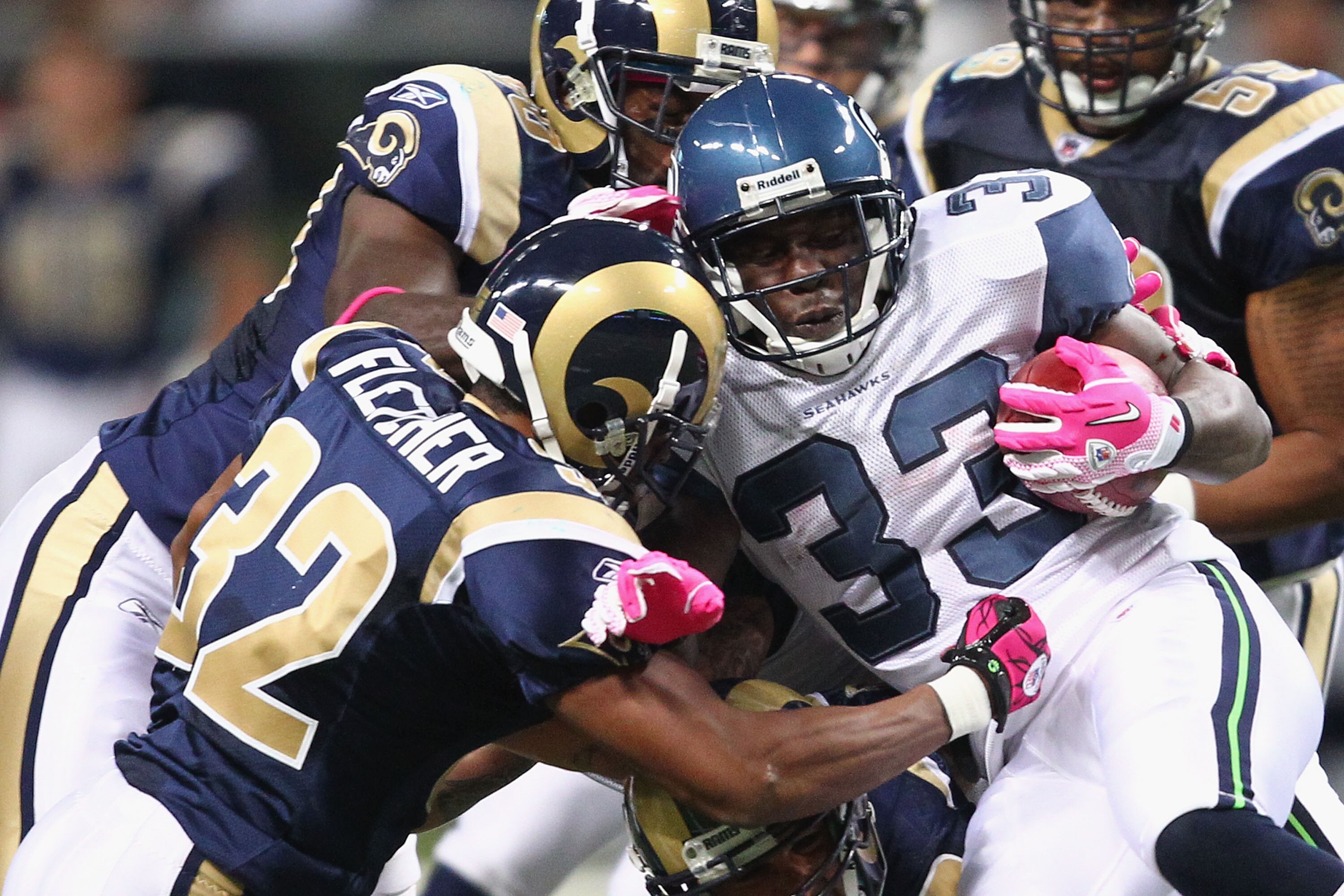 ST. LOUIS - OCTOBER 3: Leon Washington #33 of the Seattle Seahawks is stopped by Bradley Fletcher #32 at the Edward Jones Dome on October 3, 2010 in St. Louis, Missouri.  The Rams beat the Seahawks 20-3.  (Photo by Dilip Vishwanat/Getty Images)