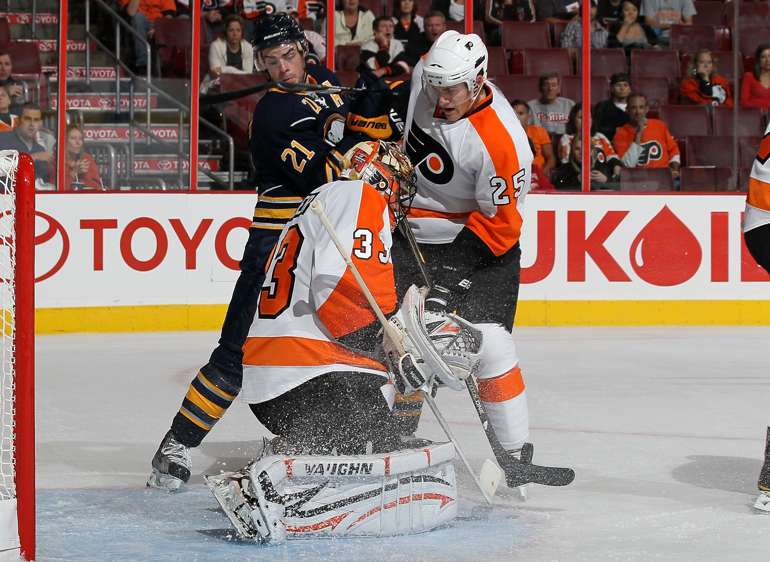 PHILADELPHIA - OCTOBER 01:  Brian Boucher #33 of the Philadelphia Flyers makes a save as teammate Matt Carle #25 defends against Drew Stafford #21 of the Buffalo Sabres on October 1, 2010 at Wells Fargo Center in Philadelphia, Pennsylvania.  (Photo by Jim