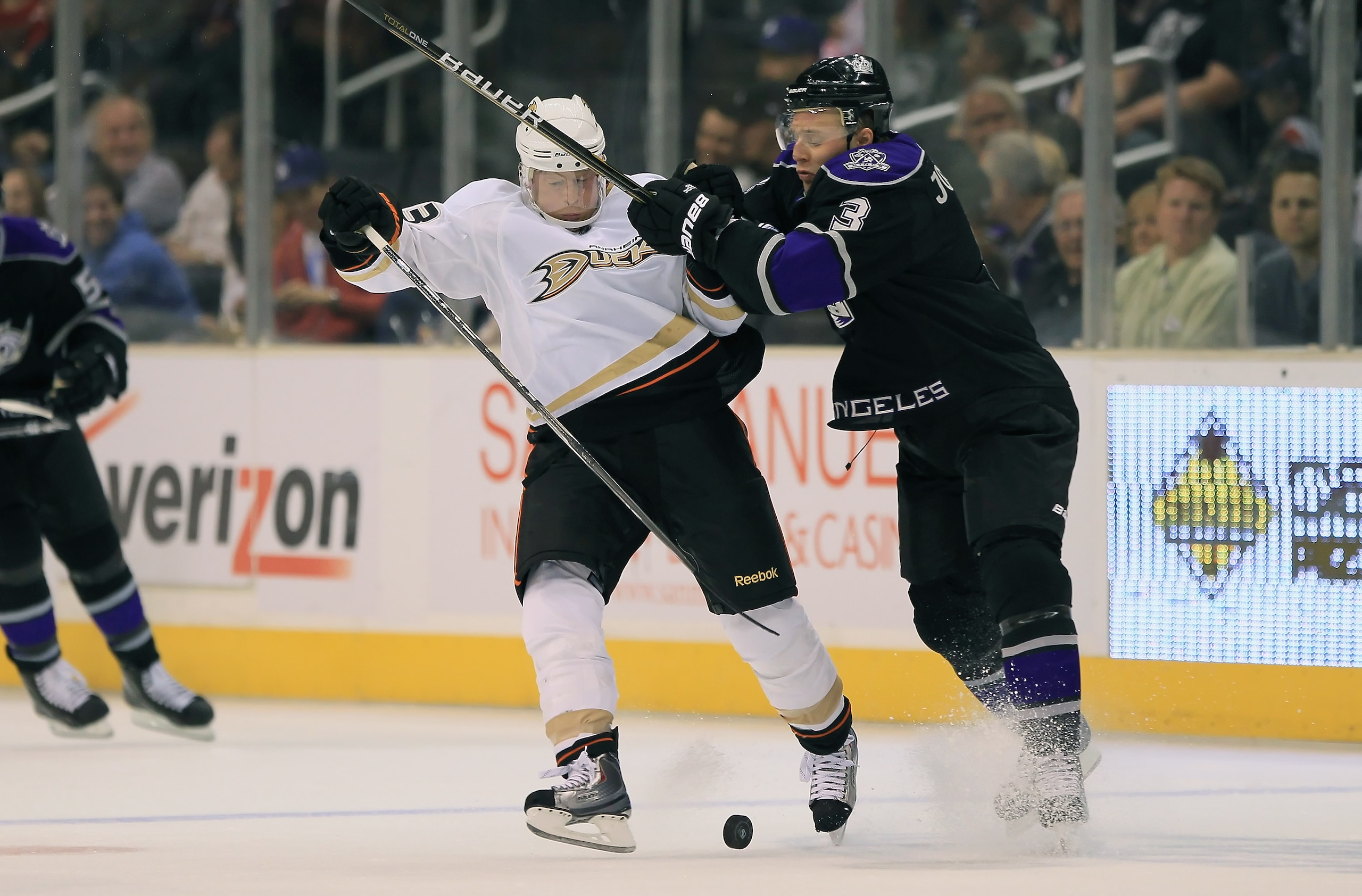 LOS ANGELES, CA - SEPTEMBER 28:  Jason Blake #33 of the Anaheim Ducks is checked by Jack Johnson #3 of the Los Angeles Kings in the first period at Staples Center on September 28, 2010 in Los Angeles, California.  (Photo by Jeff Gross/Getty Images)