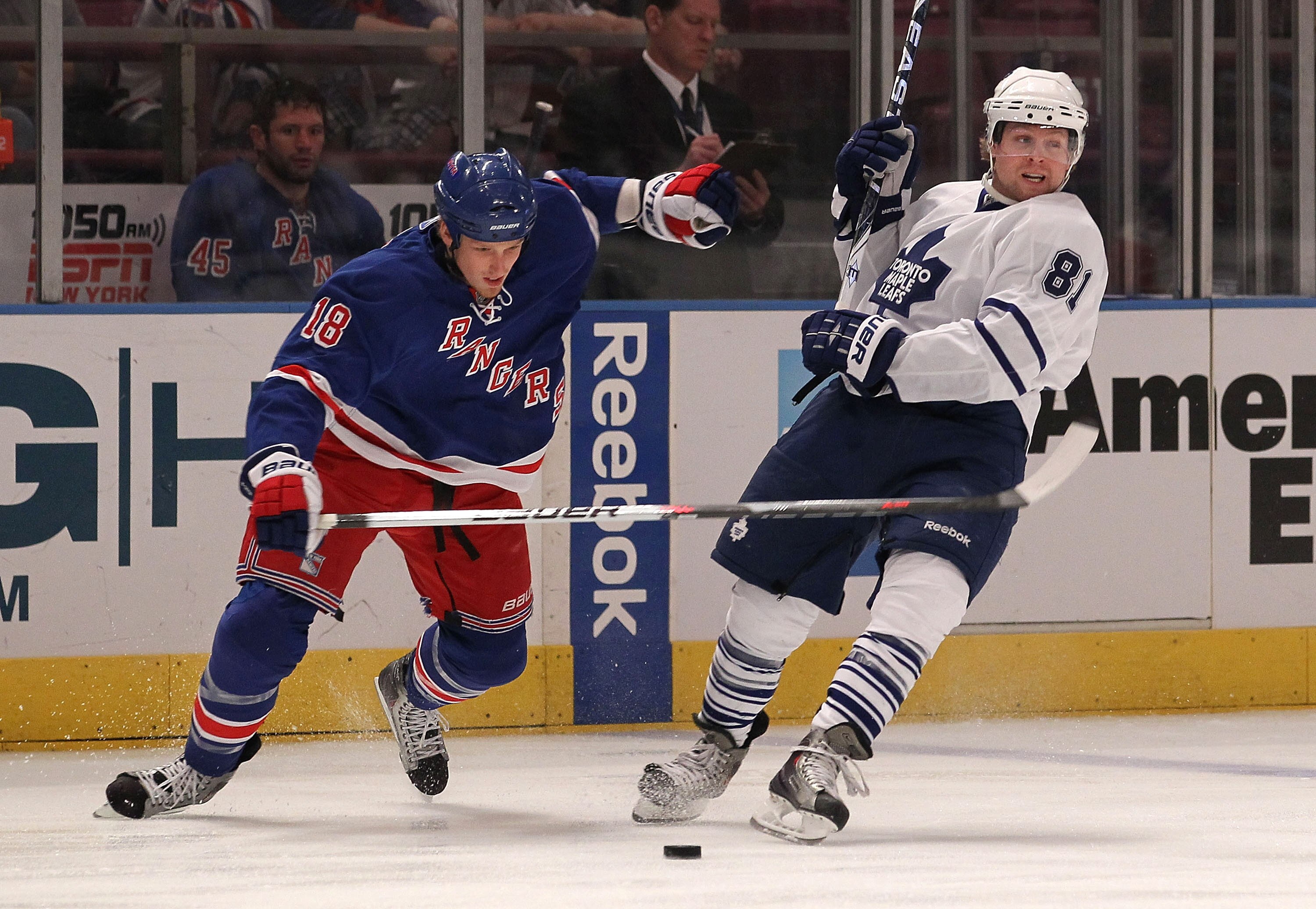 NEW YORK - APRIL 07: Phil Kessel #81 of the Toronto Maple Leafs is knocked off balance by Marc Staal #18 of the New York Rangers at Madison Square Garden on April 7, 2010 in New York City.  (Photo by Bruce Bennett/Getty Images)