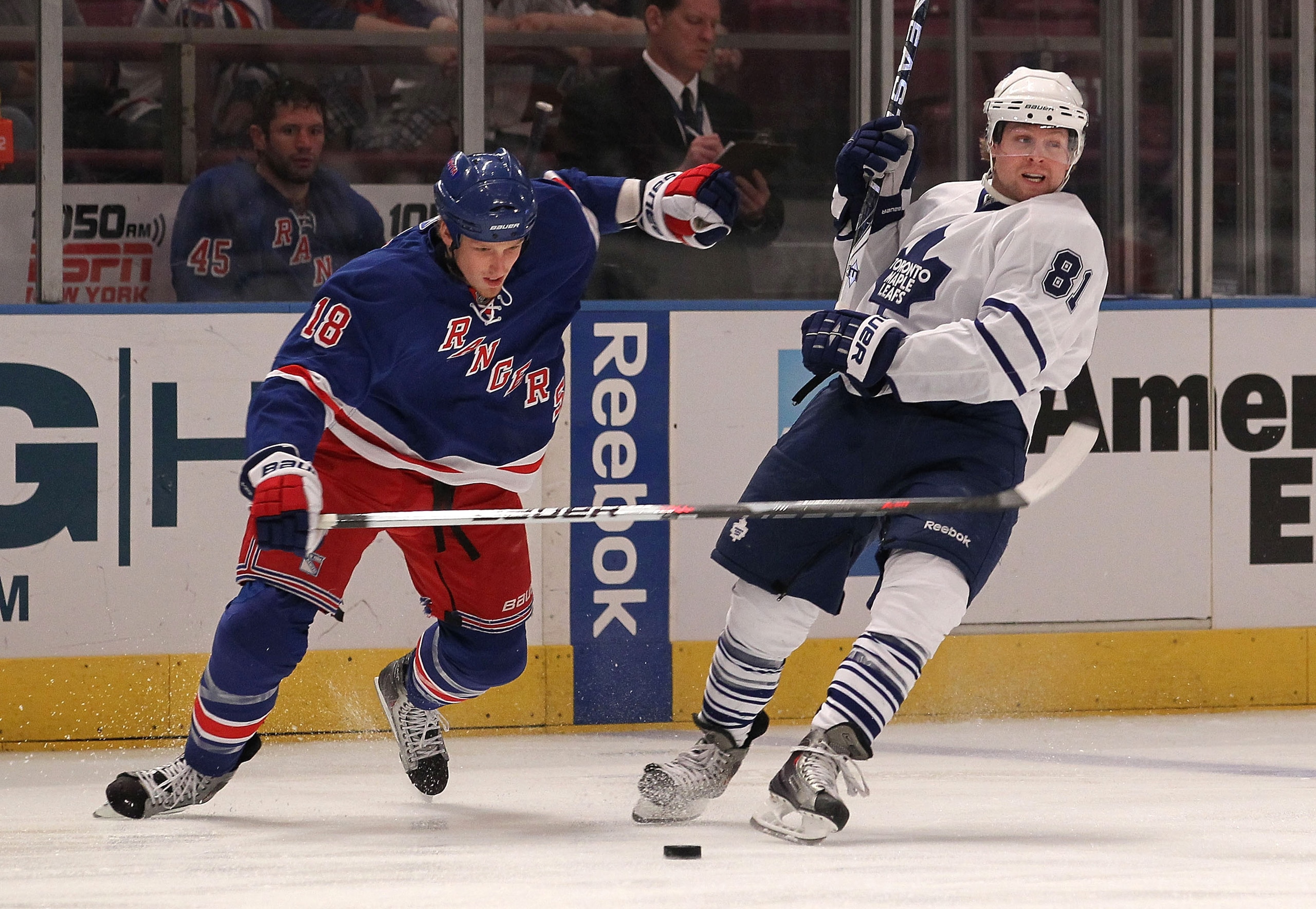 NEW YORK - APRIL 07: Phil Kessel #81 of the Toronto Maple Leafs is knocked off balance by Marc Staal #18 of the New York Rangers at Madison Square Garden on April 7, 2010 in New York City.  (Photo by Bruce Bennett/Getty Images)