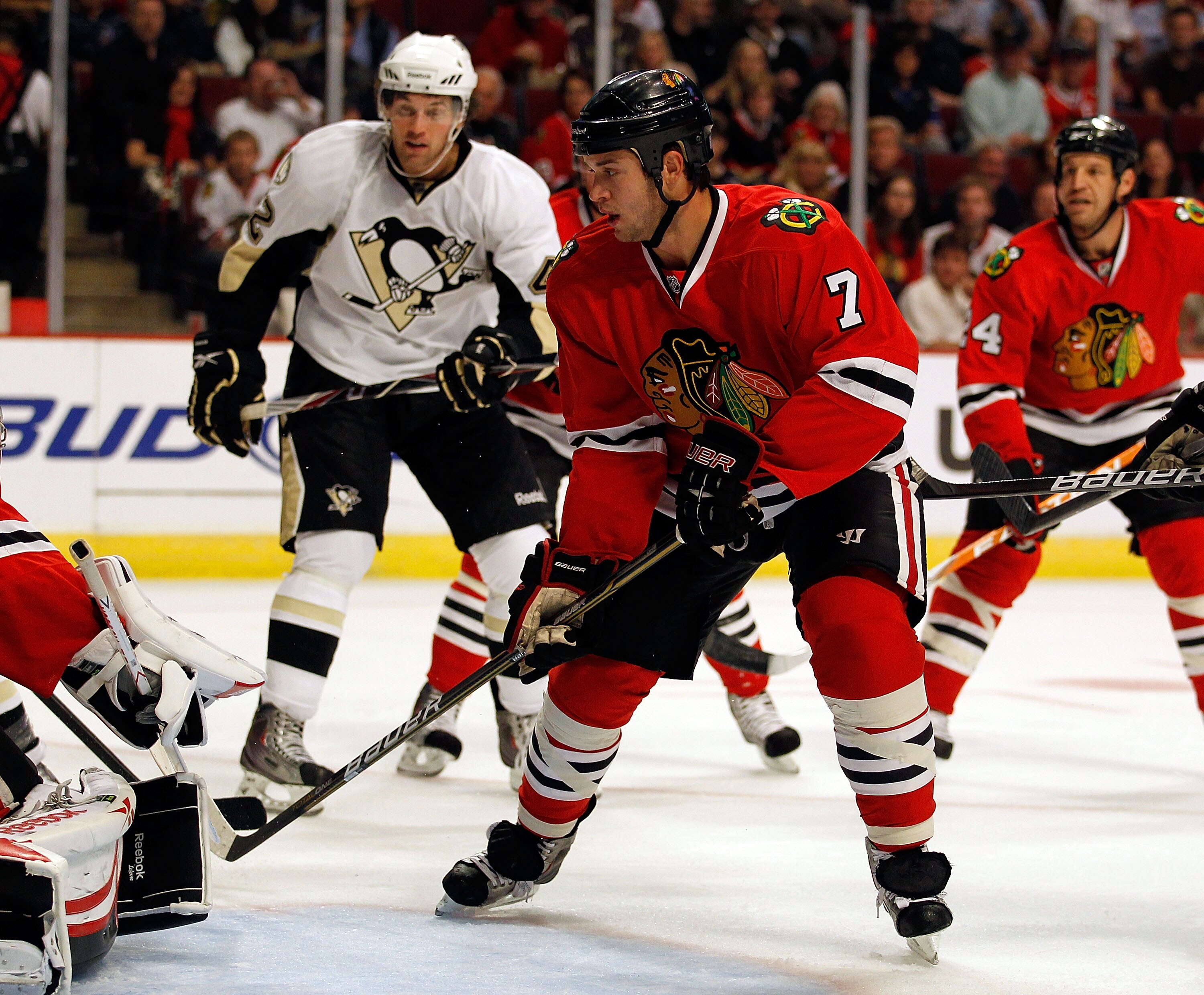 CHICAGO - OCTOBER 01: Brent Seabrook #7 of the Chicago Blackhawks clears the puck against the Pittsburgh Penguins during a pre-season game at the United Center on October 1, 2010 in Chicago, Illinois. The Blackhawks defeated the Penguins 5-2. (Photo by Jo