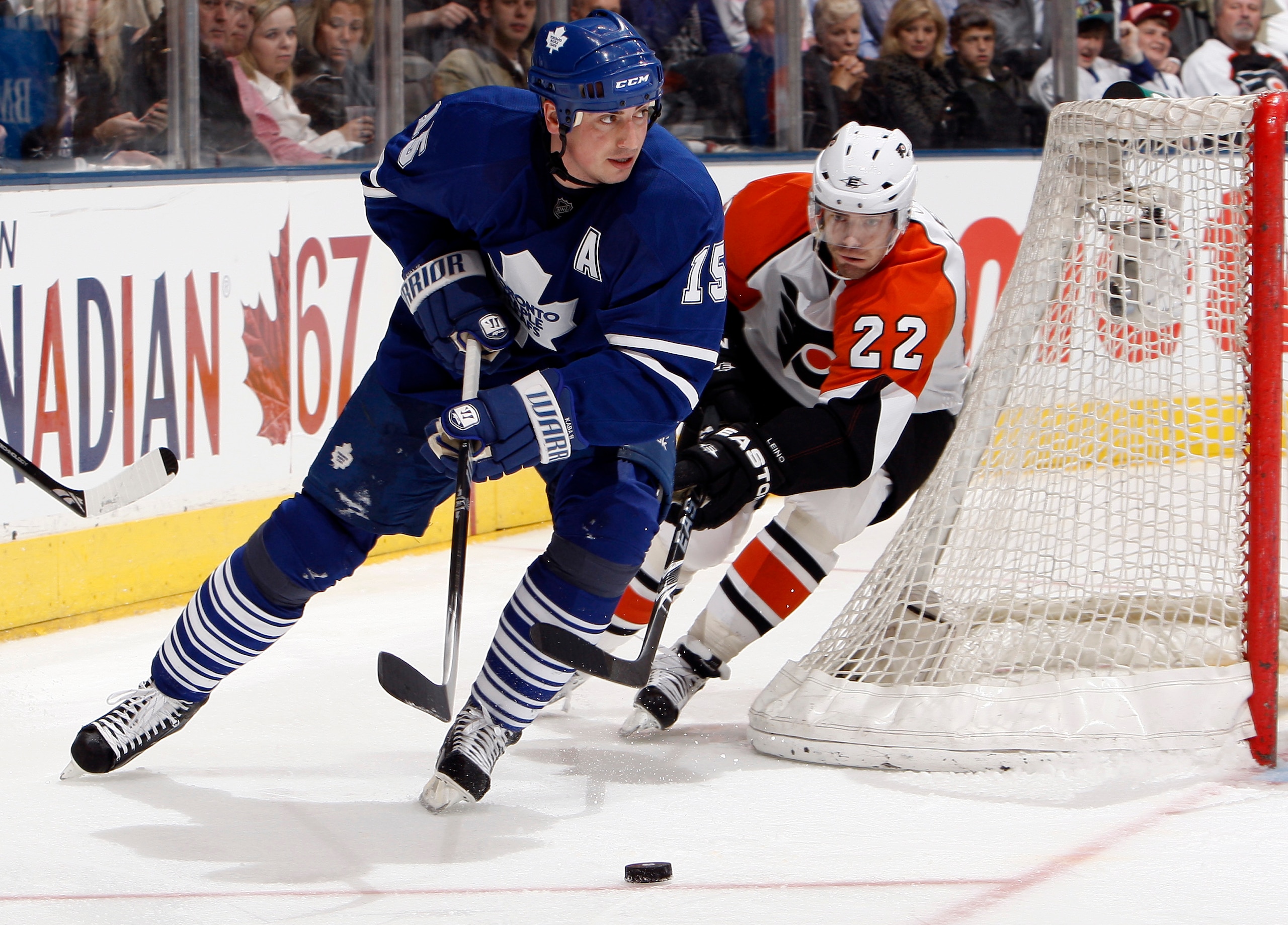 TORONTO - APRIL 6: Tomas Kaberle #15 of the Toronto Maple Leafs gets away from Ville Leino #22 of the Philadelphia Flyers during an NHL game at the Air Canada Centre April 6, 2010 in Toronto, Ontario, Canada. (Photo by Abelimages/Getty Images)