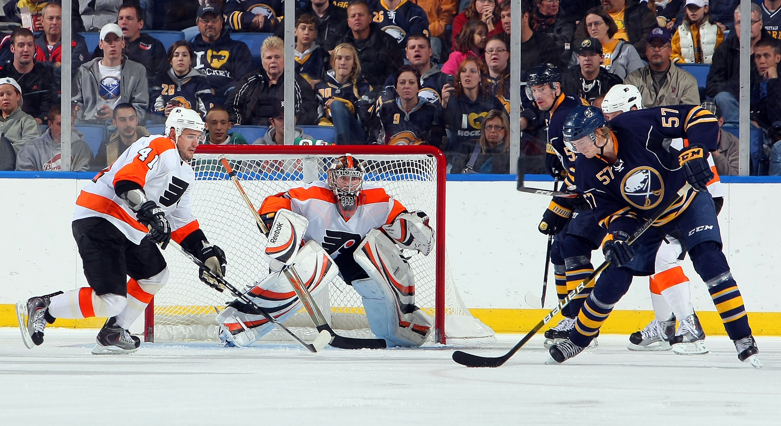 BUFFALO - OCTOBER 3:  Sergei Bobrovsky #35 of the Philadelphia Flyers positions himsself to stop a shot from Tyler Myers #57 of the Buffalo Sabres as Andrej Meszaros #41 of the Philadelphia Flyers looks on during their NHL preseason game at HSBC Arena Oct