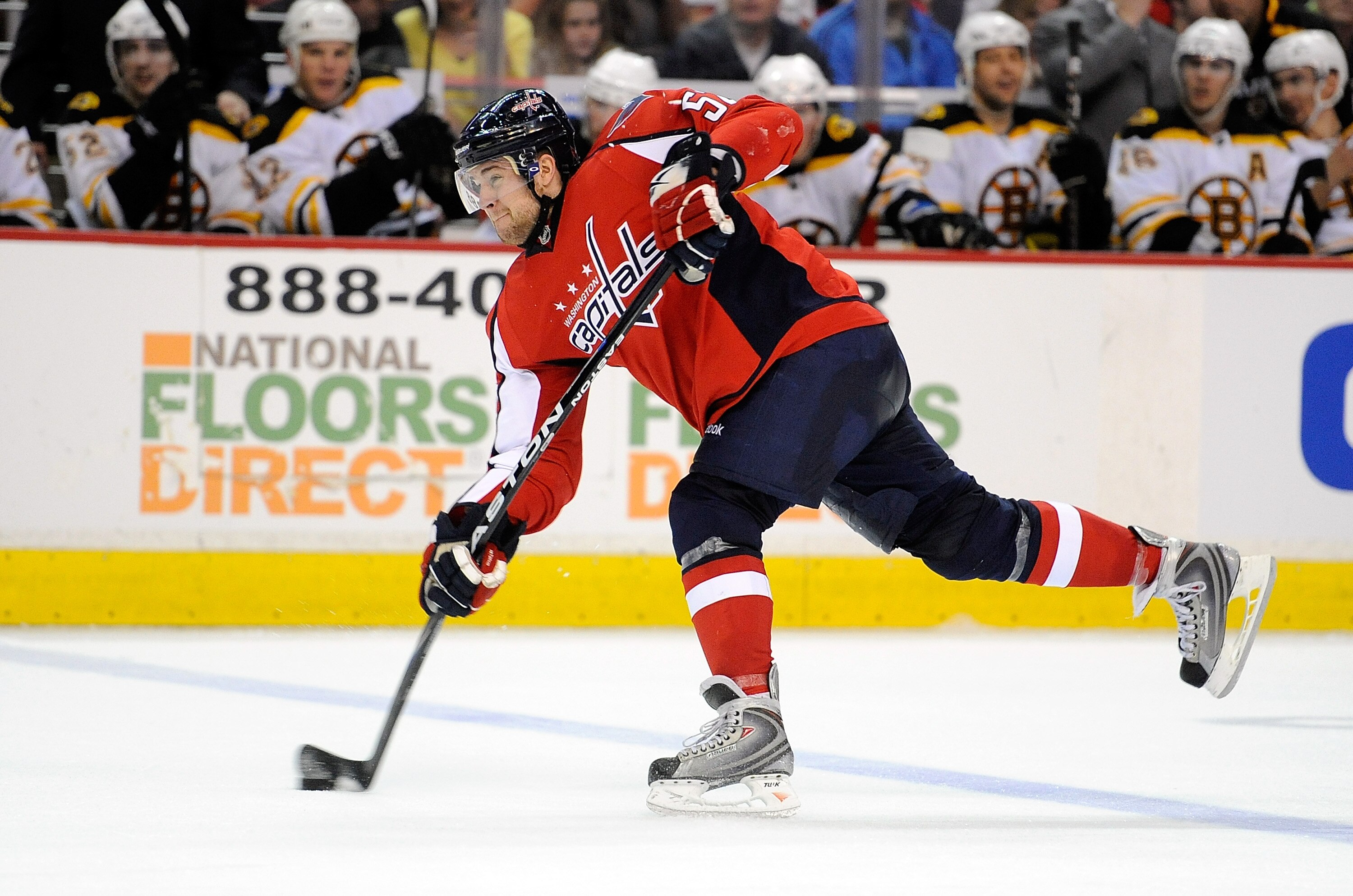 WASHINGTON - APRIL 11:  Mike Green #52 of the Washington Capitals shoots the puck against the Boston Bruins at the Verizon Center on April 11, 2010 in Washington, DC.  (Photo by Greg Fiume/Getty Images)