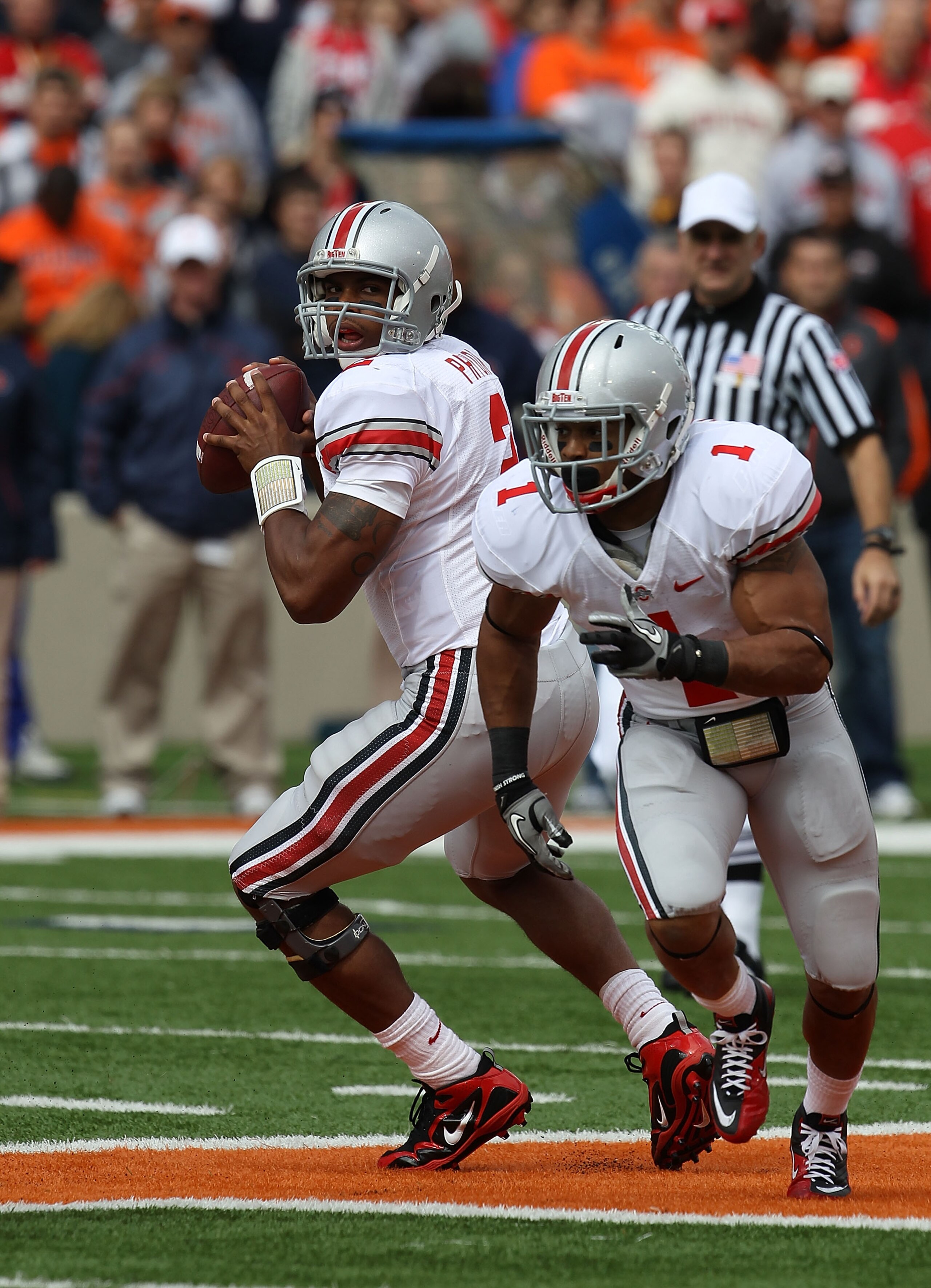 CHAMPAIGN, IL - OCTOBER 02: Terrelle Pryor #2 of the Ohio State Buckeyes looks for a receiver as teammate Dan Herron #1 runs a route against the Illinois Fighting Illini at Memorial Stadium on October 2, 2010 in Champaign, Illinois. Ohio State defeated Il