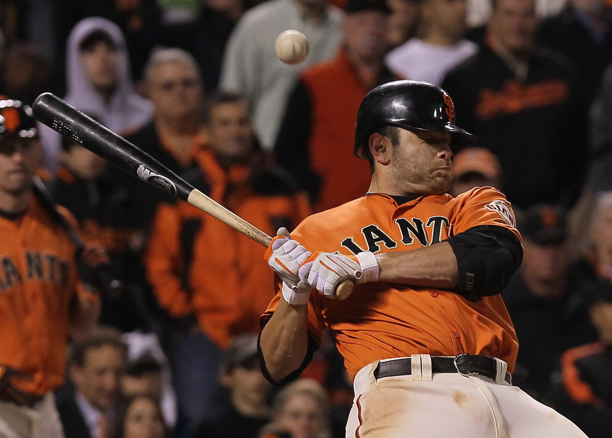 SAN FRANCISCO - OCTOBER 08:  Freddy Sanchez #21 of the San Francisco Giants gets hit by a pitch during the tenth inning of the National League Division Series with the Atlanta Braves at AT&T Park on October 8, 2010 in San Francisco, California. The Braves