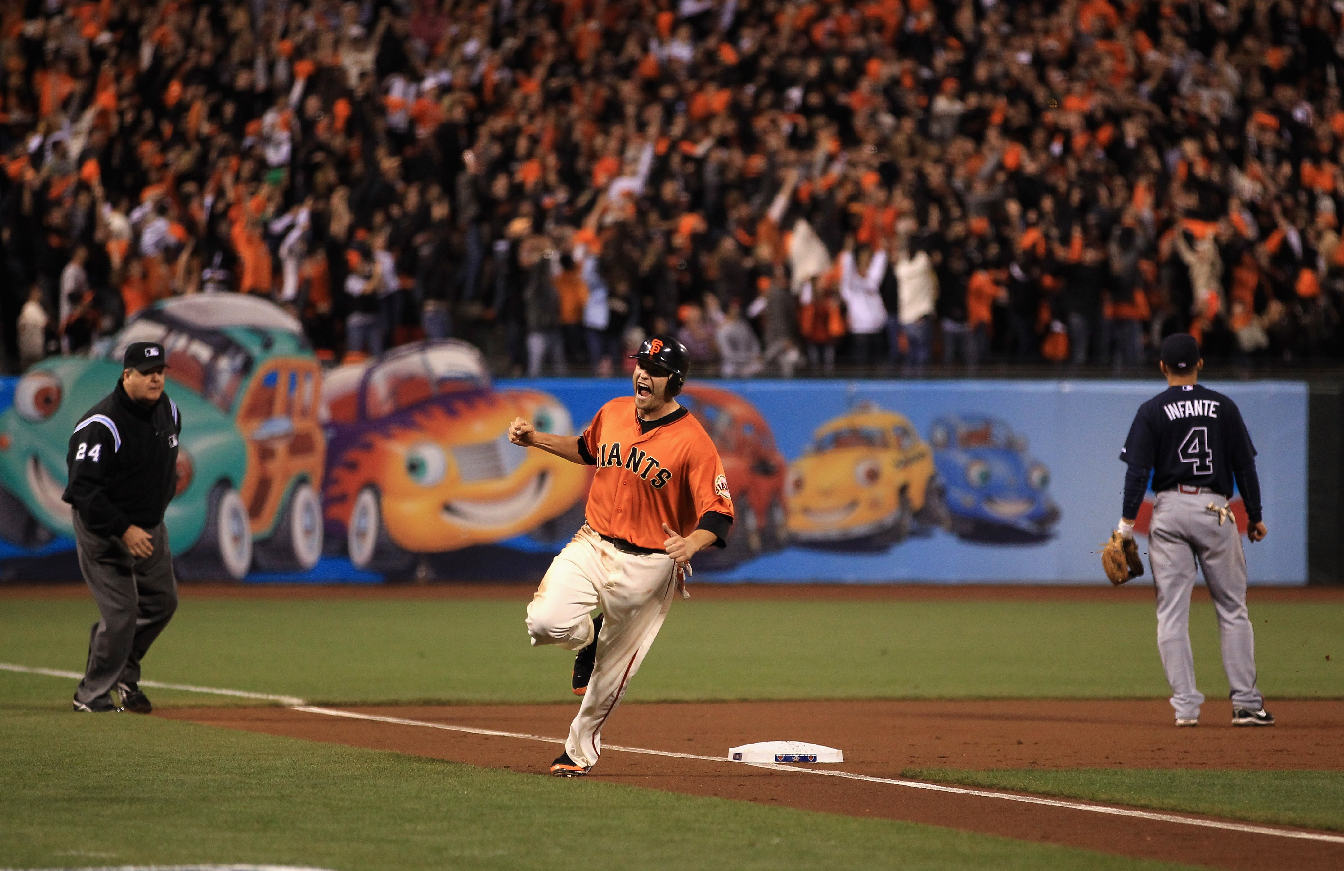 SAN FRANCISCO - OCTOBER 08:  Freddy Sanchez #21 of the San Francisco Giants reacts as he rounds third base on a home run by Pat Burrell #9 in the first inning against the Atlanta Braves in game 2 of the NLDS at AT&T Park on October 8, 2010 in San Francisc