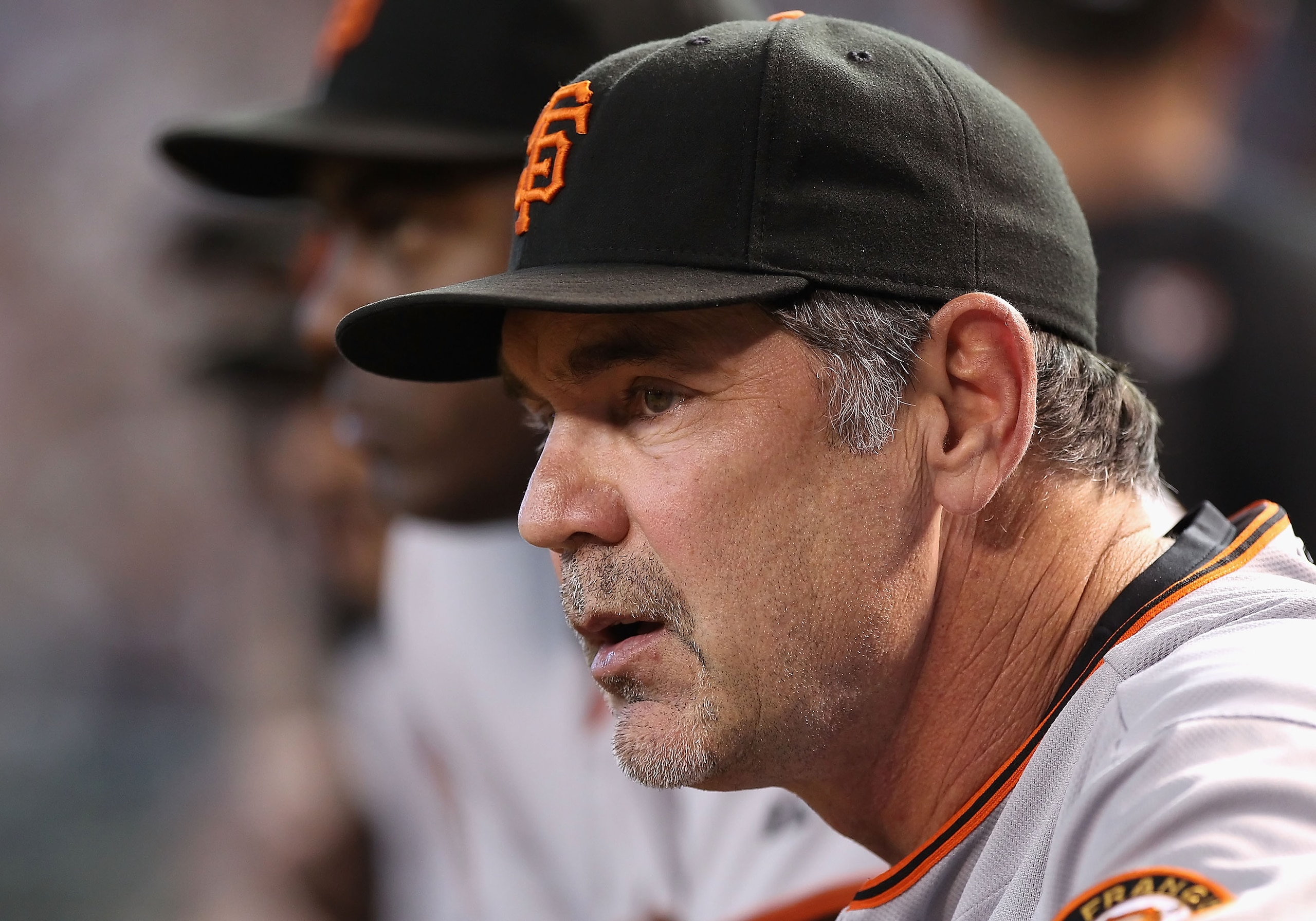 PHOENIX - SEPTEMBER 06:  Manager Bruce Bochy of the San Francisco Giants watches from dugout during the Major League Baseball game against the Arizona Diamondbacks at Chase Field on September 6, 2010 in Phoenix, Arizona.  The Giants defeated the Diamondba