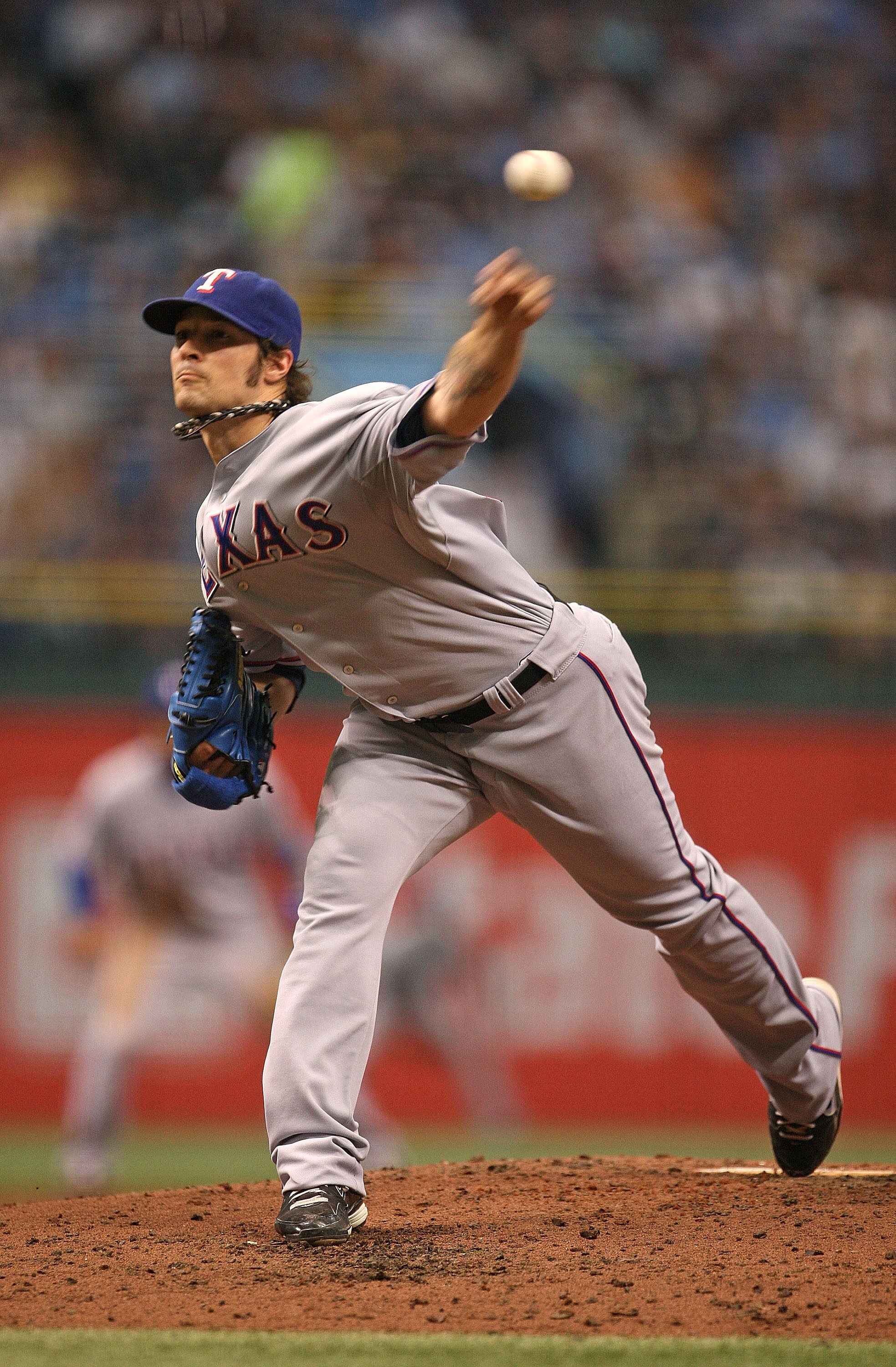 ST PETERSBURG, FL - OCTOBER 07:  C.J. Wilson #36 of the Texas Rangers pitches during Game 2 of the ALDS against the Tampa Bay Rays at Tropicana Field on October 7, 2010 in St. Petersburg, Florida.  (Photo by Mike Ehrmann/Getty Images)