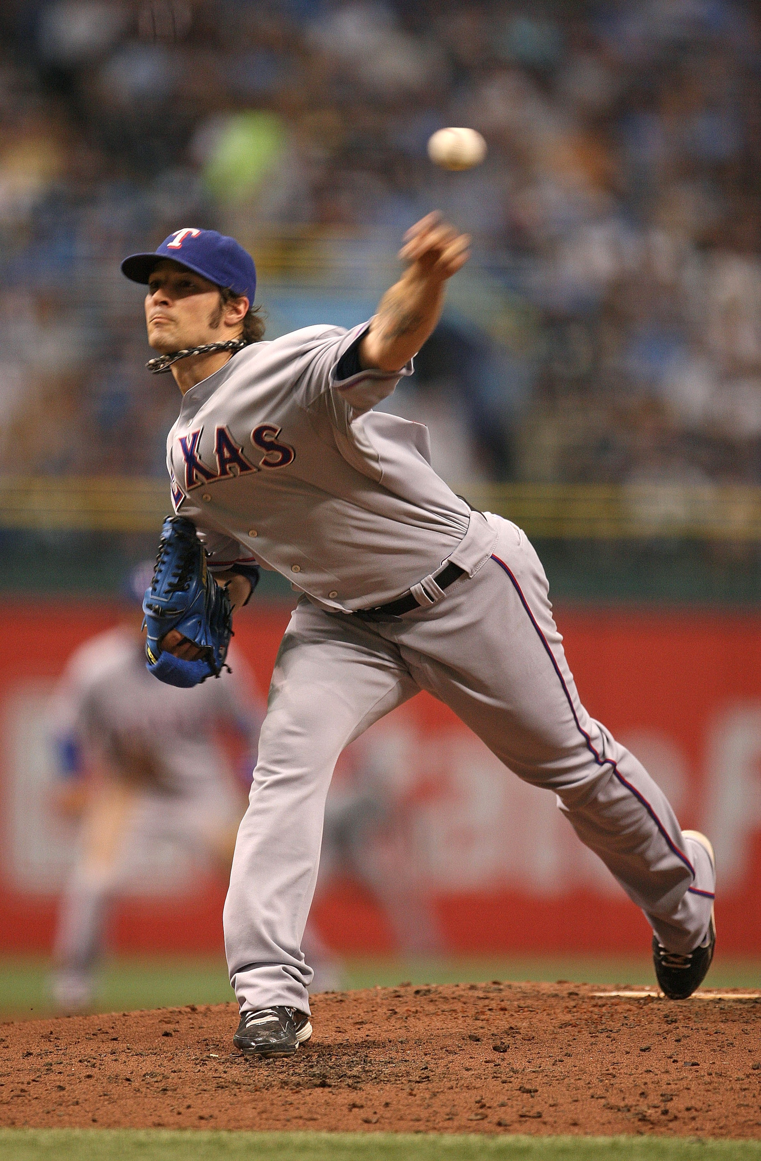 ST PETERSBURG, FL - OCTOBER 07:  C.J. Wilson #36 of the Texas Rangers pitches during Game 2 of the ALDS against the Tampa Bay Rays at Tropicana Field on October 7, 2010 in St. Petersburg, Florida.  (Photo by Mike Ehrmann/Getty Images)