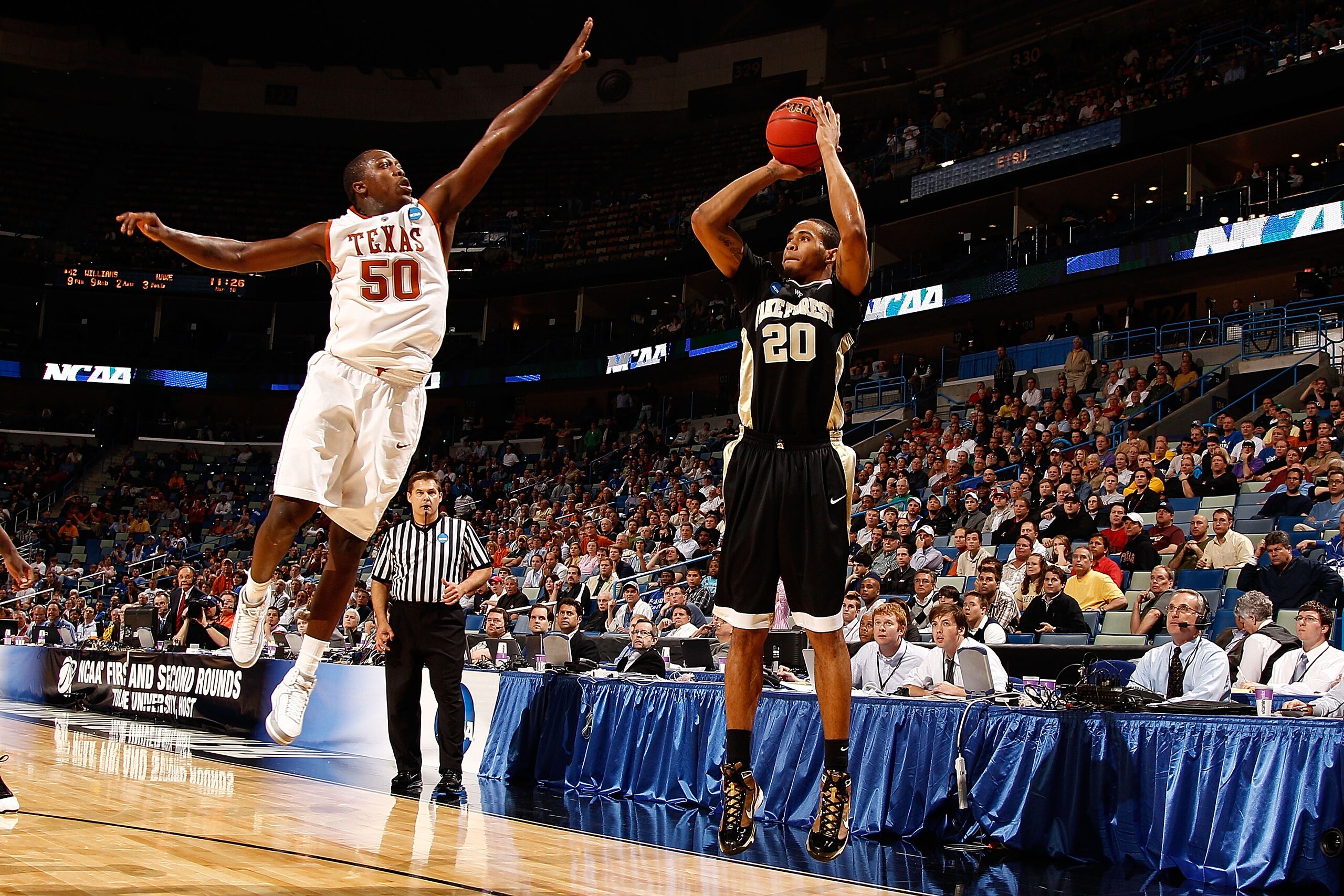 NEW ORLEANS - MARCH 18:  Ari Stewart #20 of the Wake Forest Demon Deacons makes a shot over J'Covan Brown #50 of the Texas Longhorns 81-80 in overtime during the first round of the 2010 NCAA menï¿½s basketball tournament at the New Orleans Arena on March 18